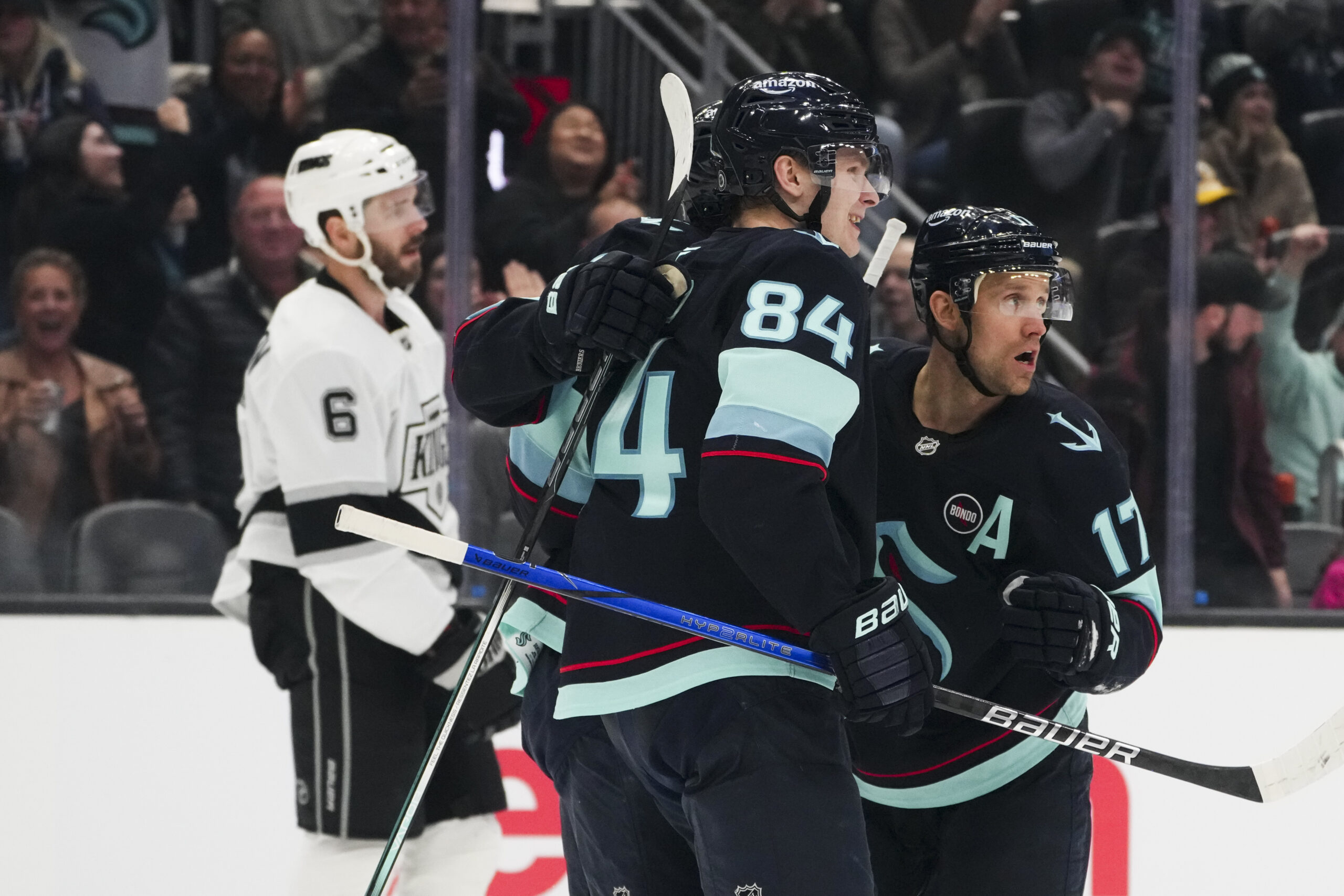 Seattle Kraken center Jaden Schwartz, right, celebrates his goal with...