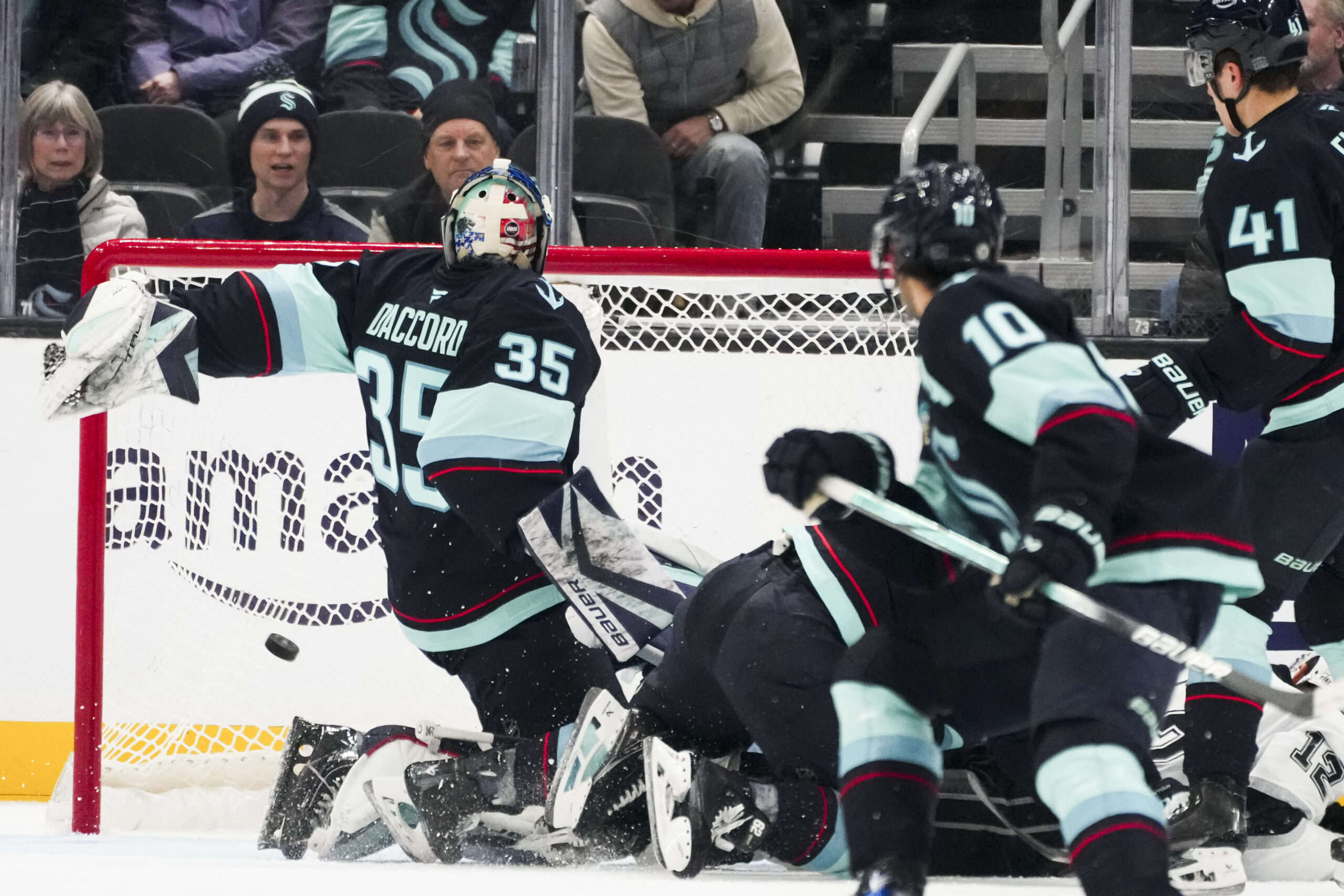 Seattle Kraken goaltender Joey Daccord (35) can’t make a save...