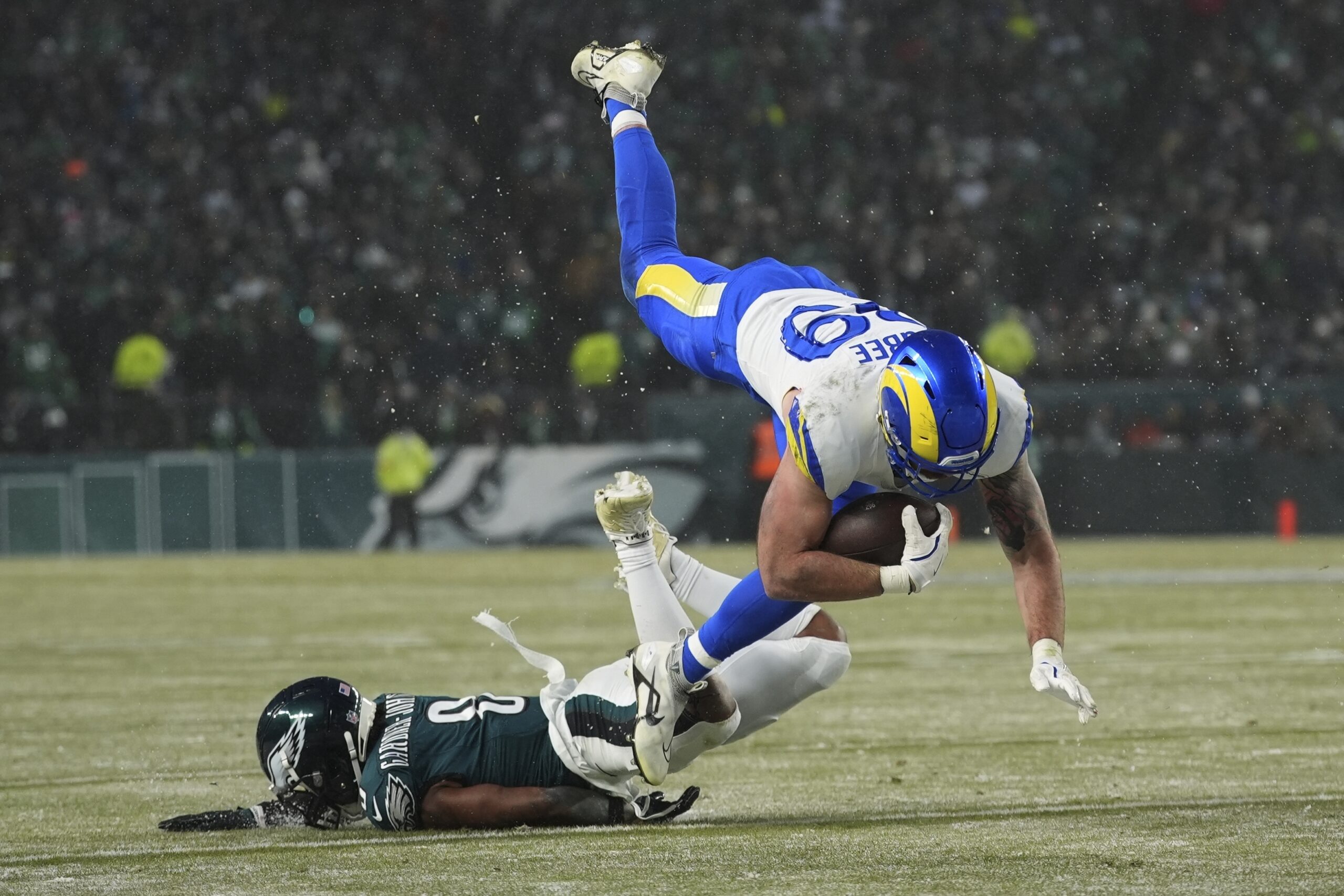 Los Angeles Rams tight end Tyler Higbee (89) is tackled...