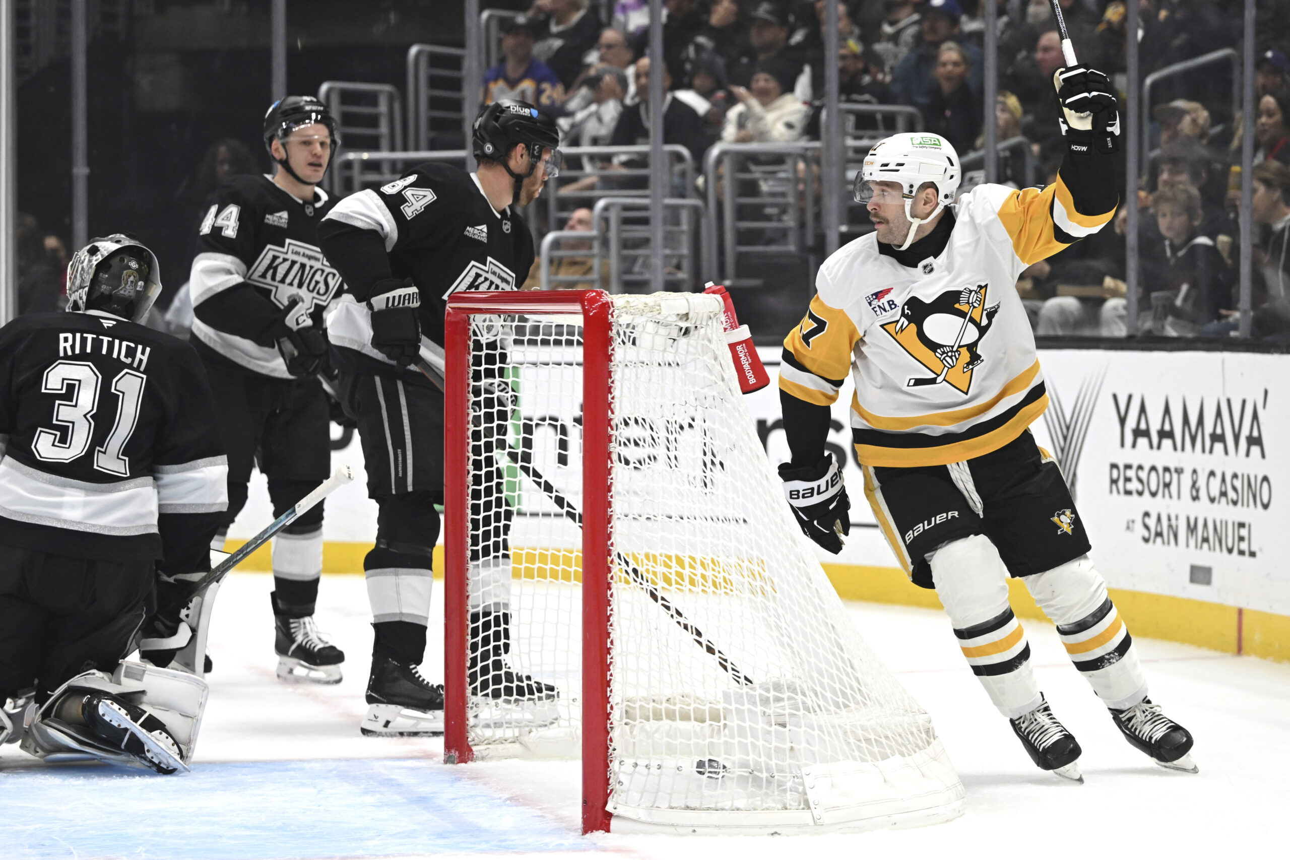 Kings goaltender David Rittich (31), right wing Alex Laferriere (14)...