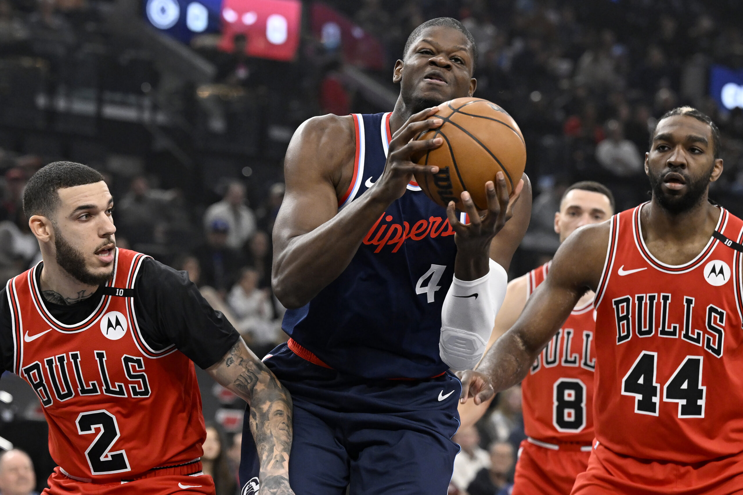 Clippers center Mo Bamba (4) pulls down a rebound as...