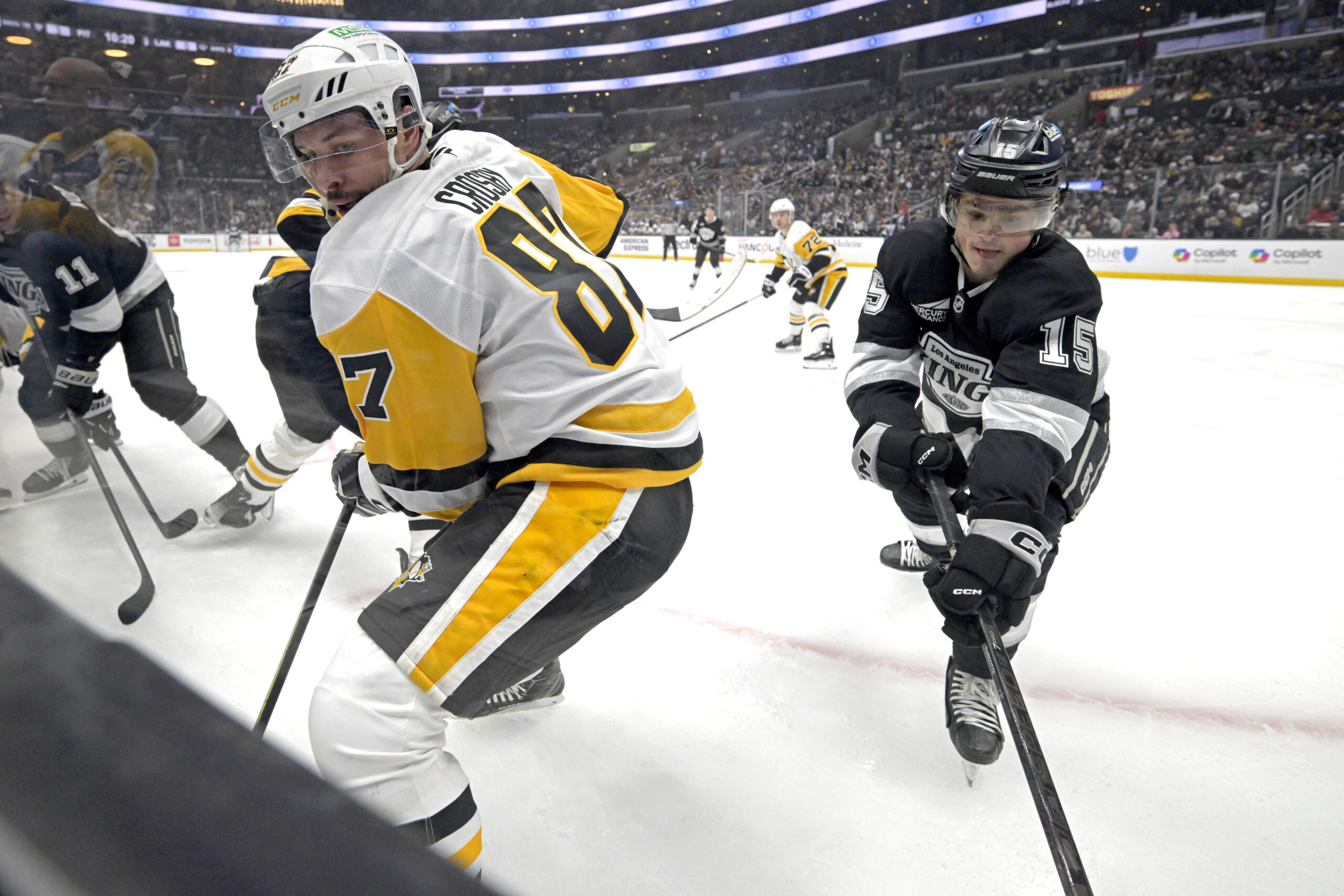 Pittsburgh Penguins center Sidney Crosby, left, and Kings center Alex...