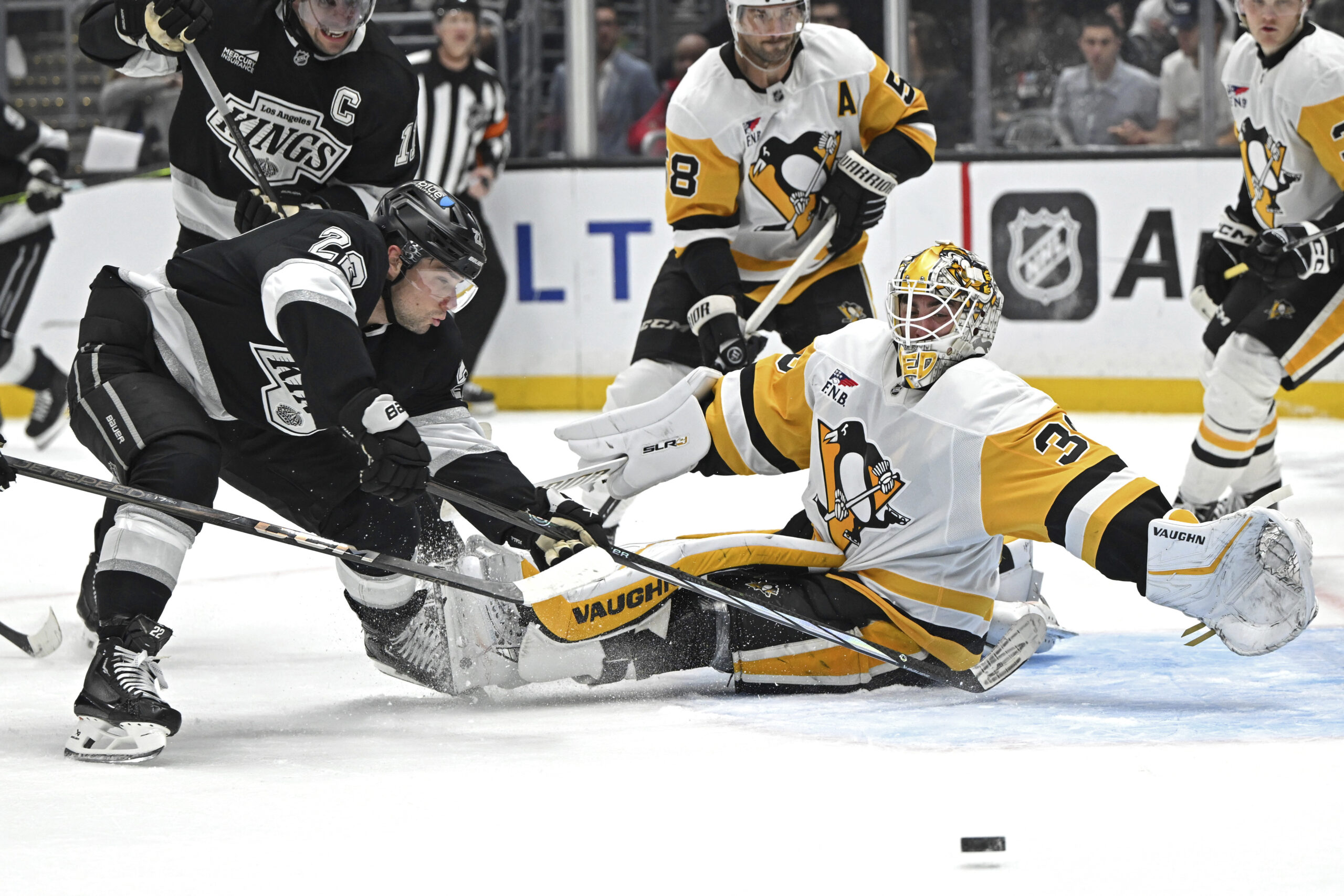 Kings left wing Kevin Fiala (22) reaches for a pass...