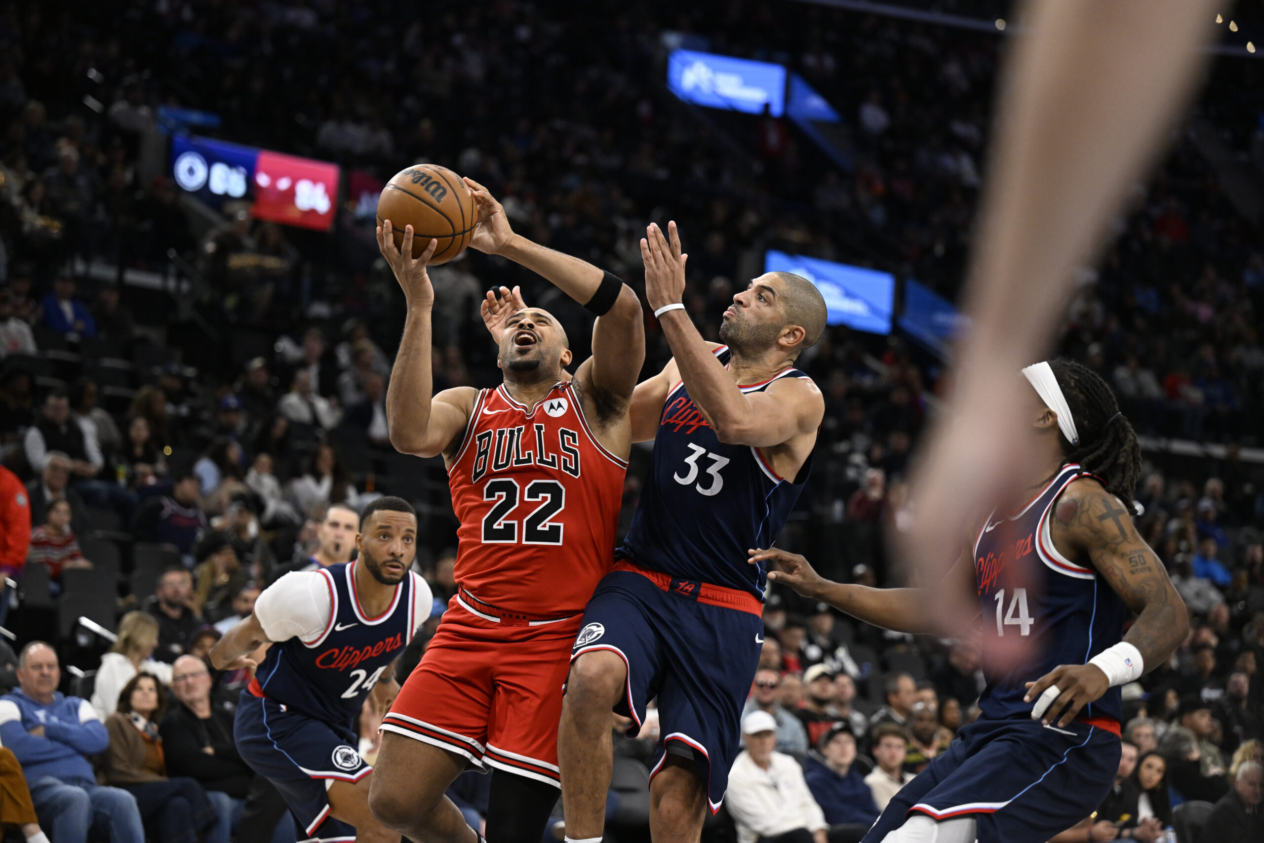 The Chicago Bulls’ Talen Horton-Tucker, left, shoots as the Clippers’...