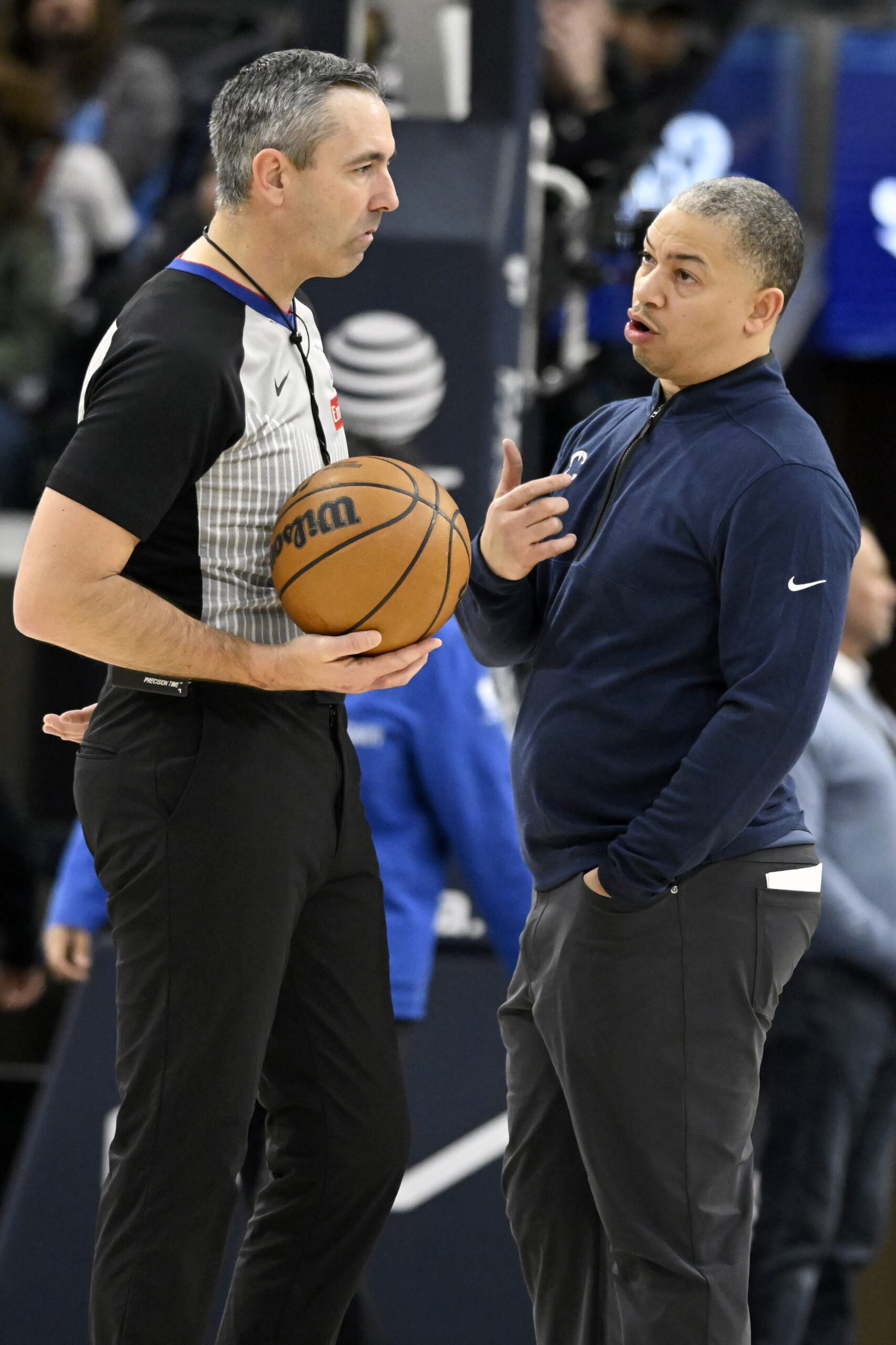 Clippers head coach Tyronn Lue, right, chats with referee Brett...