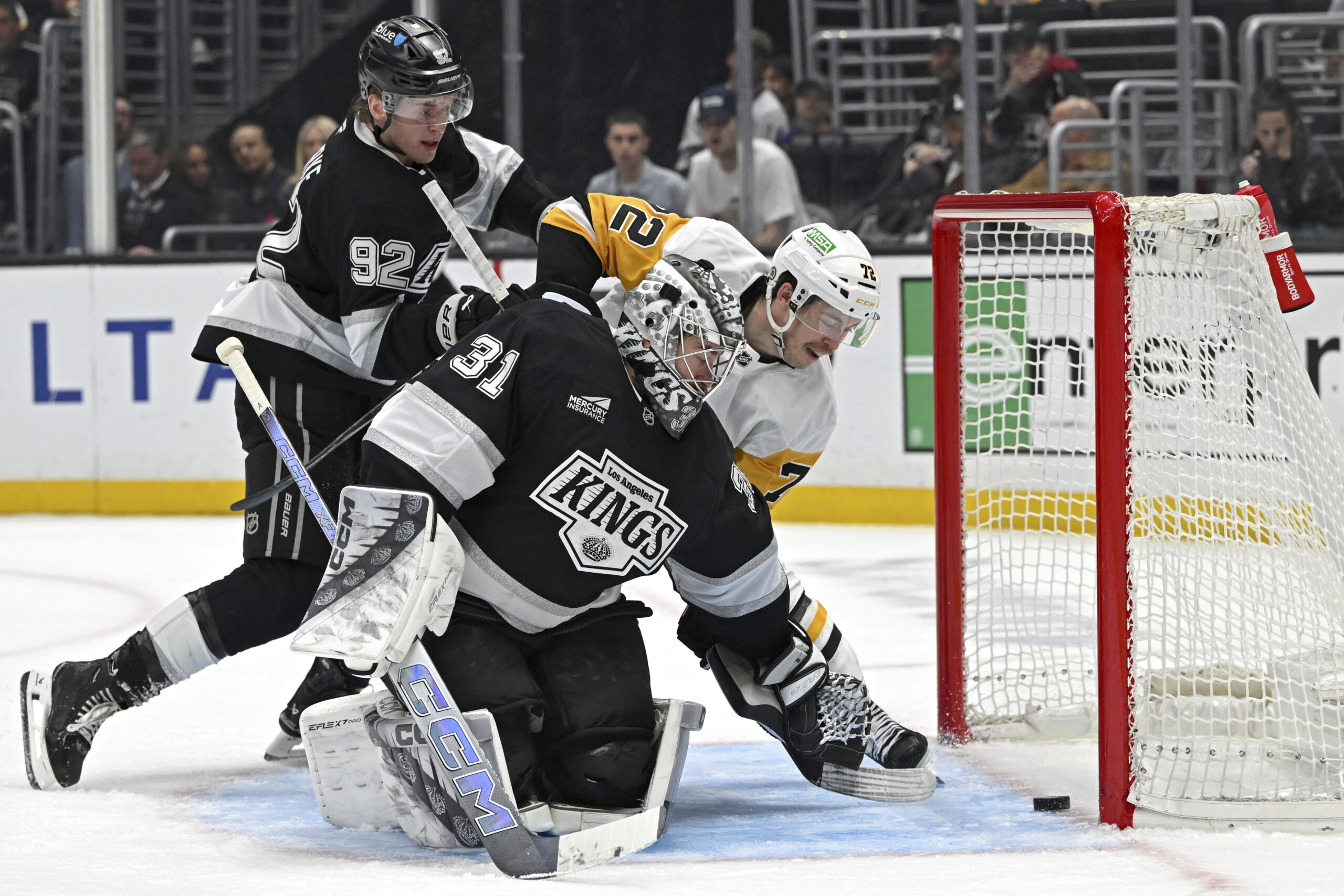 Pittsburgh Penguins left wing Anthony Beauvillier scores a goal past...