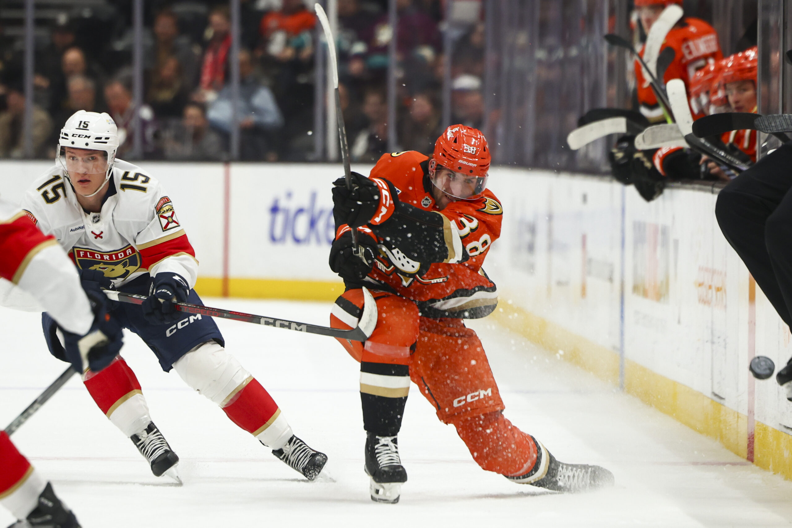 Ducks center Jansen Harkins (38) passes the puck down the...