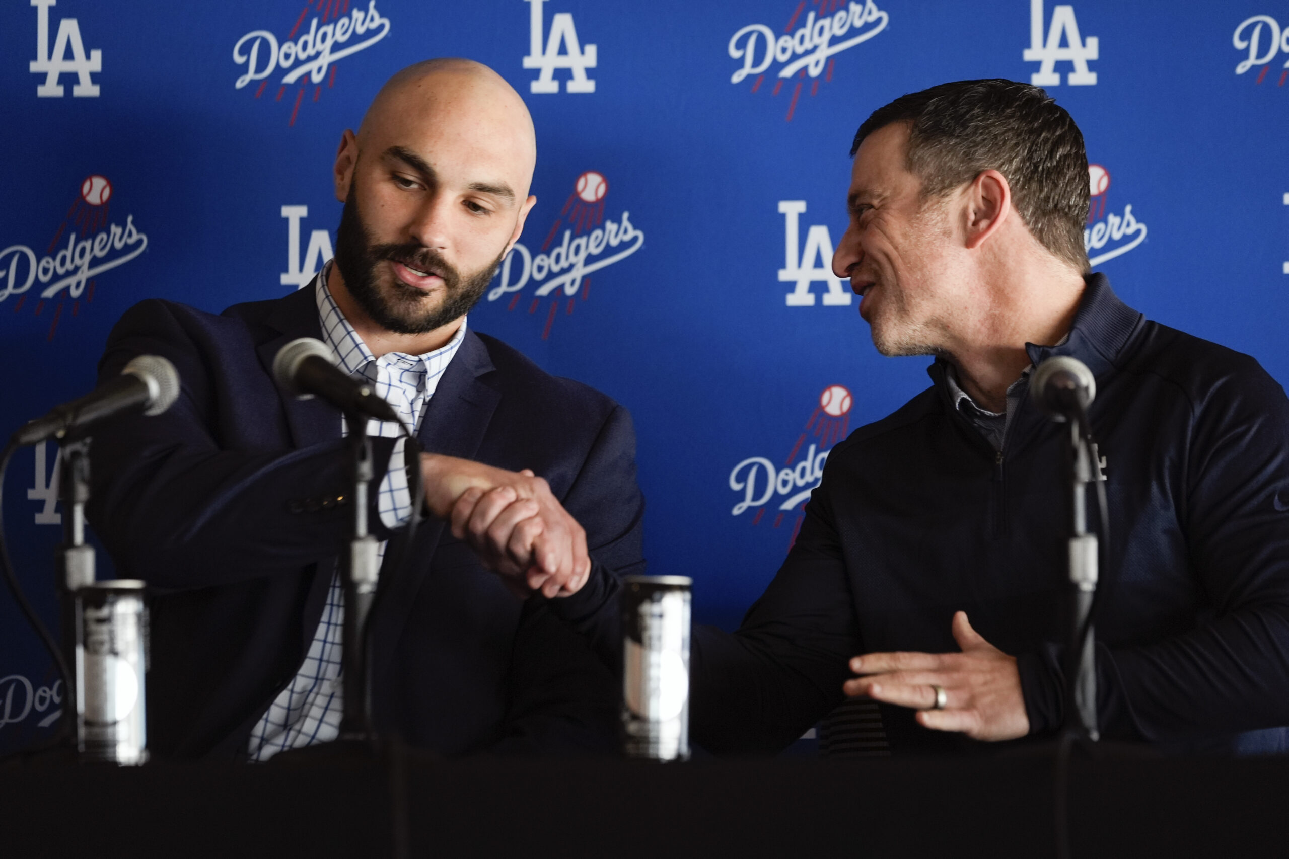 New Dodgers relief pitcher Tanner Scott, left, is greeted by...