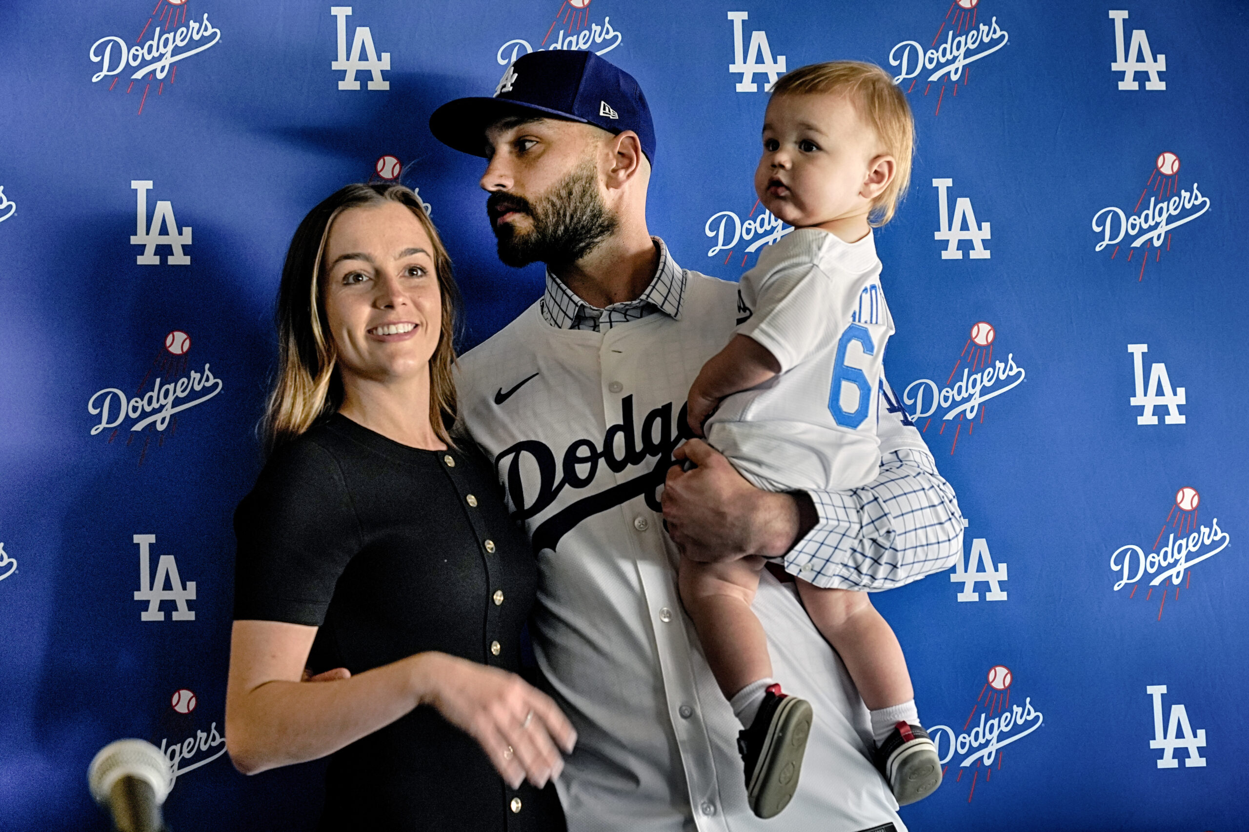 New Dodgers relief pitcher Tanner Scott is joined by his...