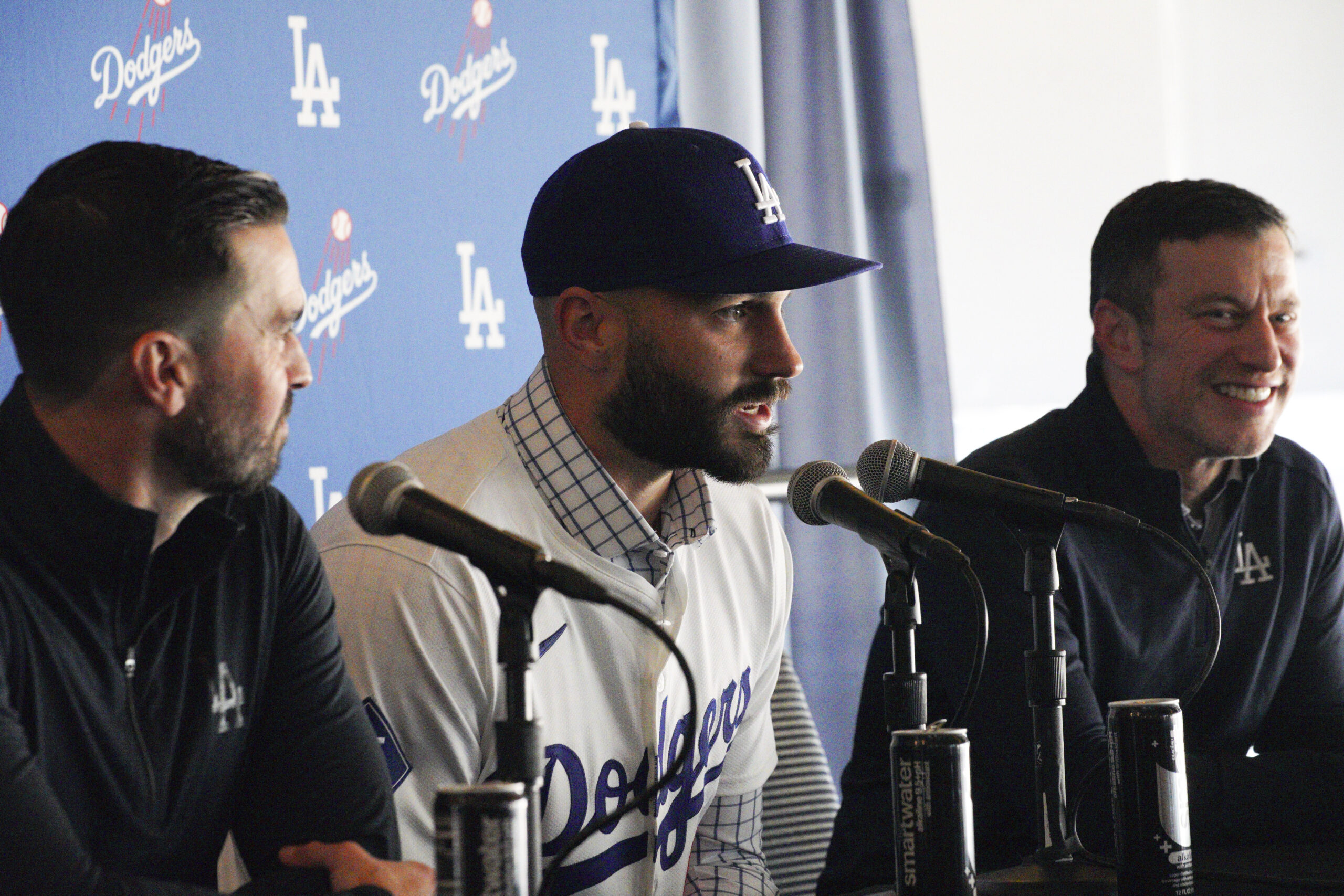 New Dodgers relief pitcher Tanner Scott, center, answers questions while...