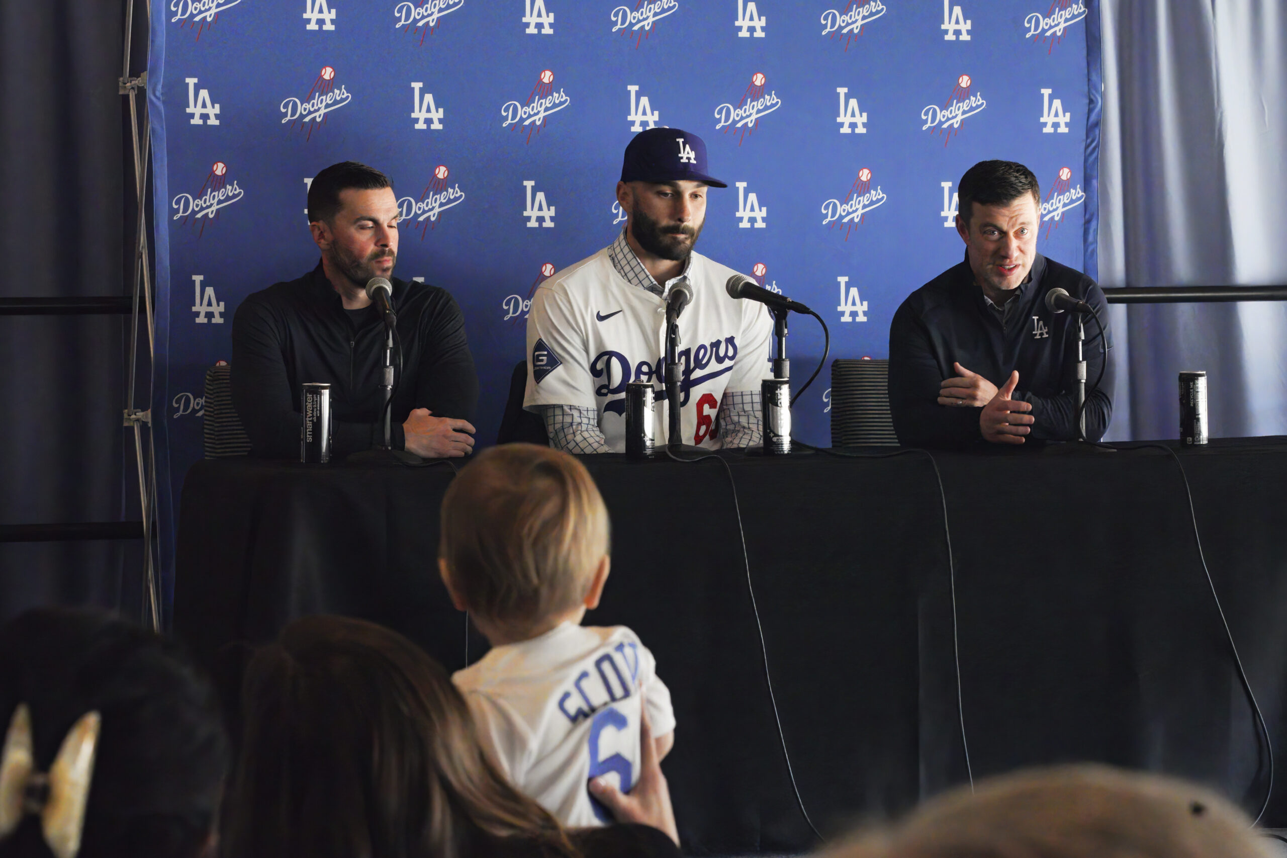 New Dodgers relief pitcher Tanner Scott, center, answers questions while...