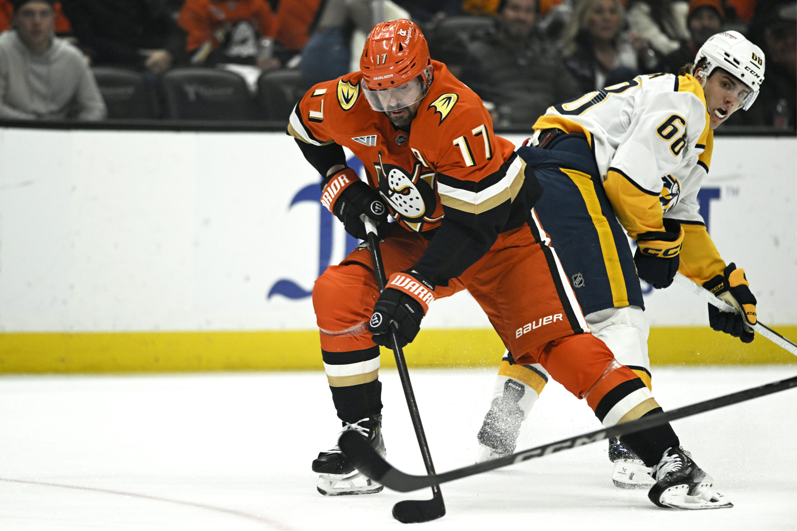 Ducks left wing Alex Killorn (17) takes the puck past...