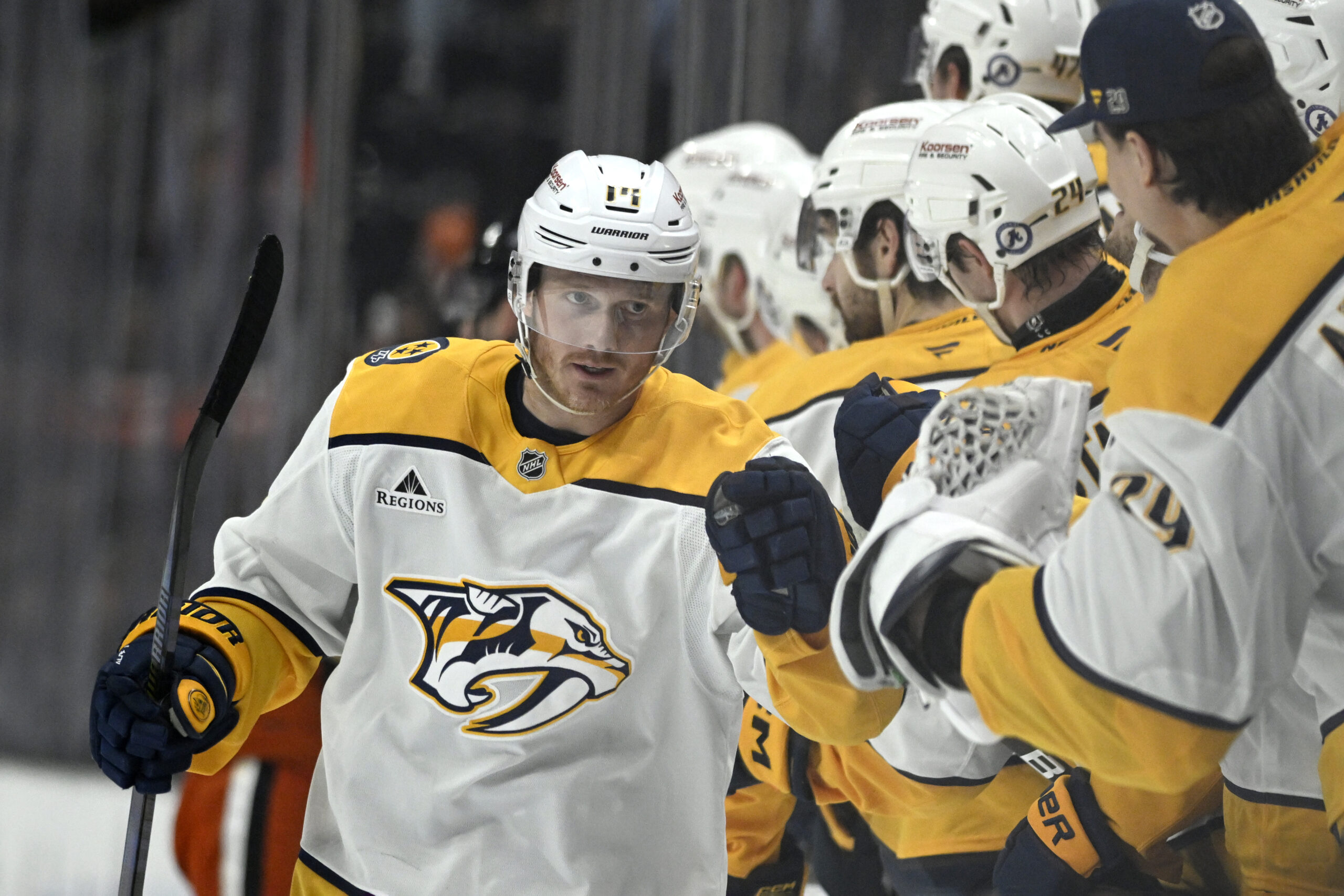 Nashville Predators center Gustav Nyquist, left, celebrates with teammates after...