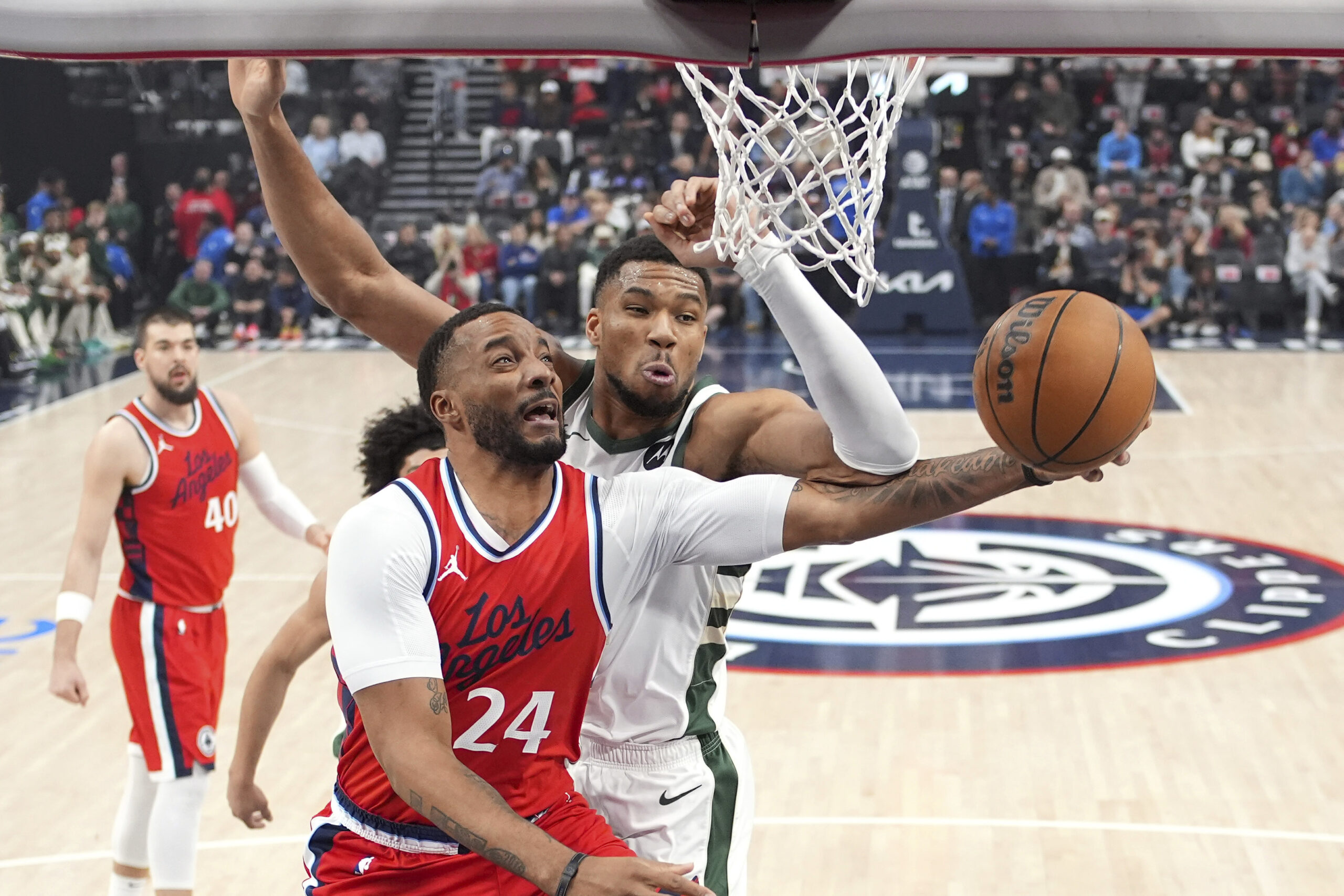 Clippers guard Norman Powell (24) shoots as Milwaukee Bucks forward...