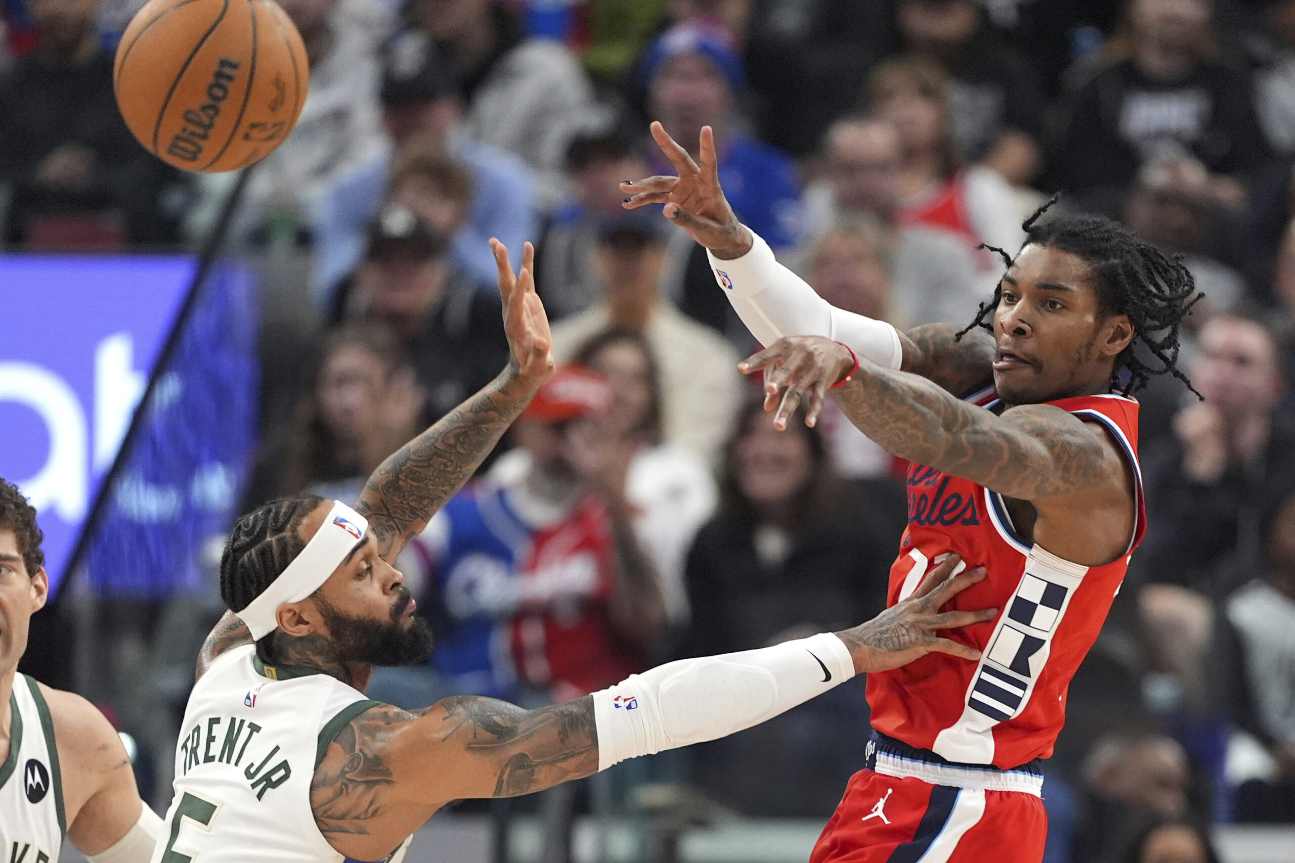 Clippers guard Kevin Porter Jr., right, passes the ball as...