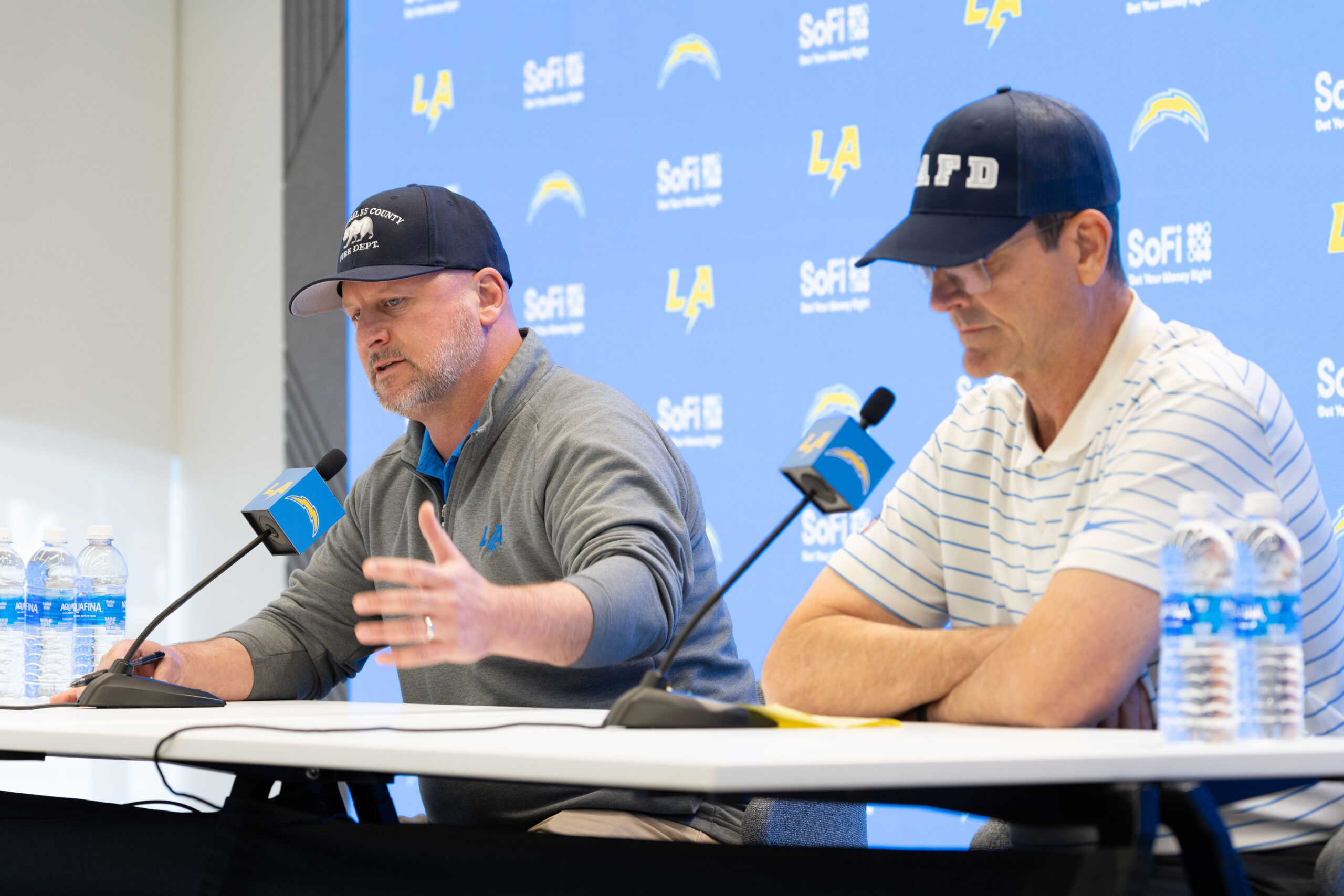 Chargers general manager Joe Hortiz, left, and head coach Jim...