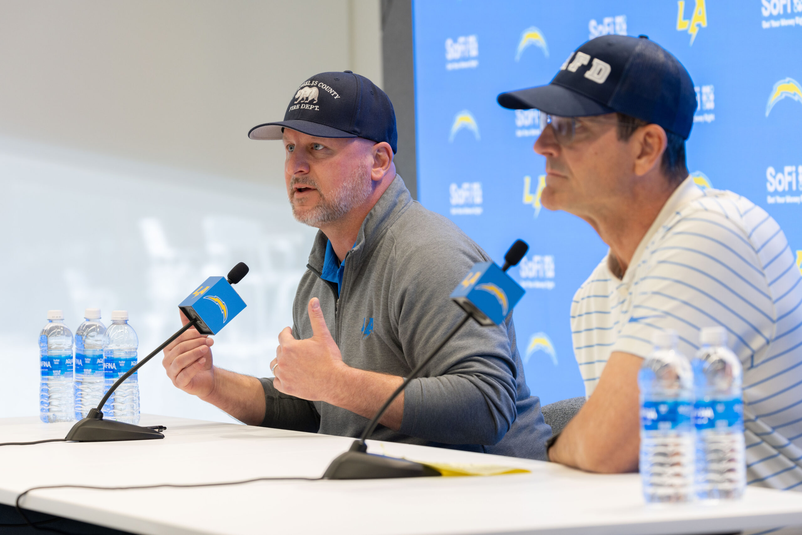 Chargers general manager Joe Hortiz, left, and head coach Jim...