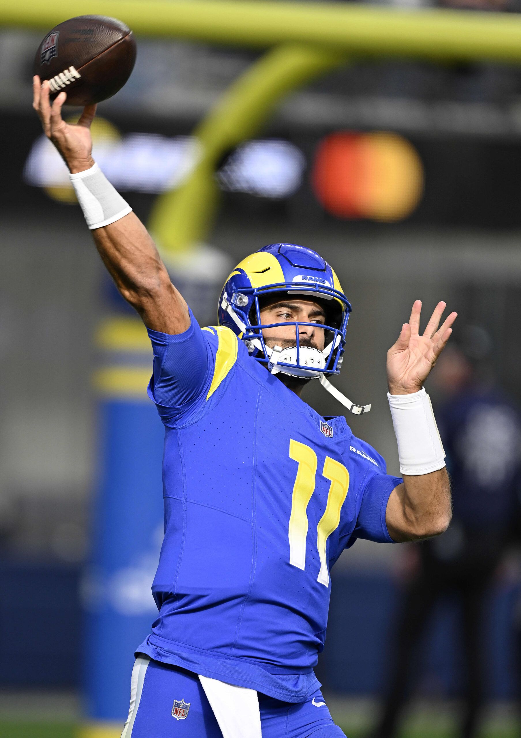 Rams backup quarterback Jimmy Garoppolo warms up prior to starting...