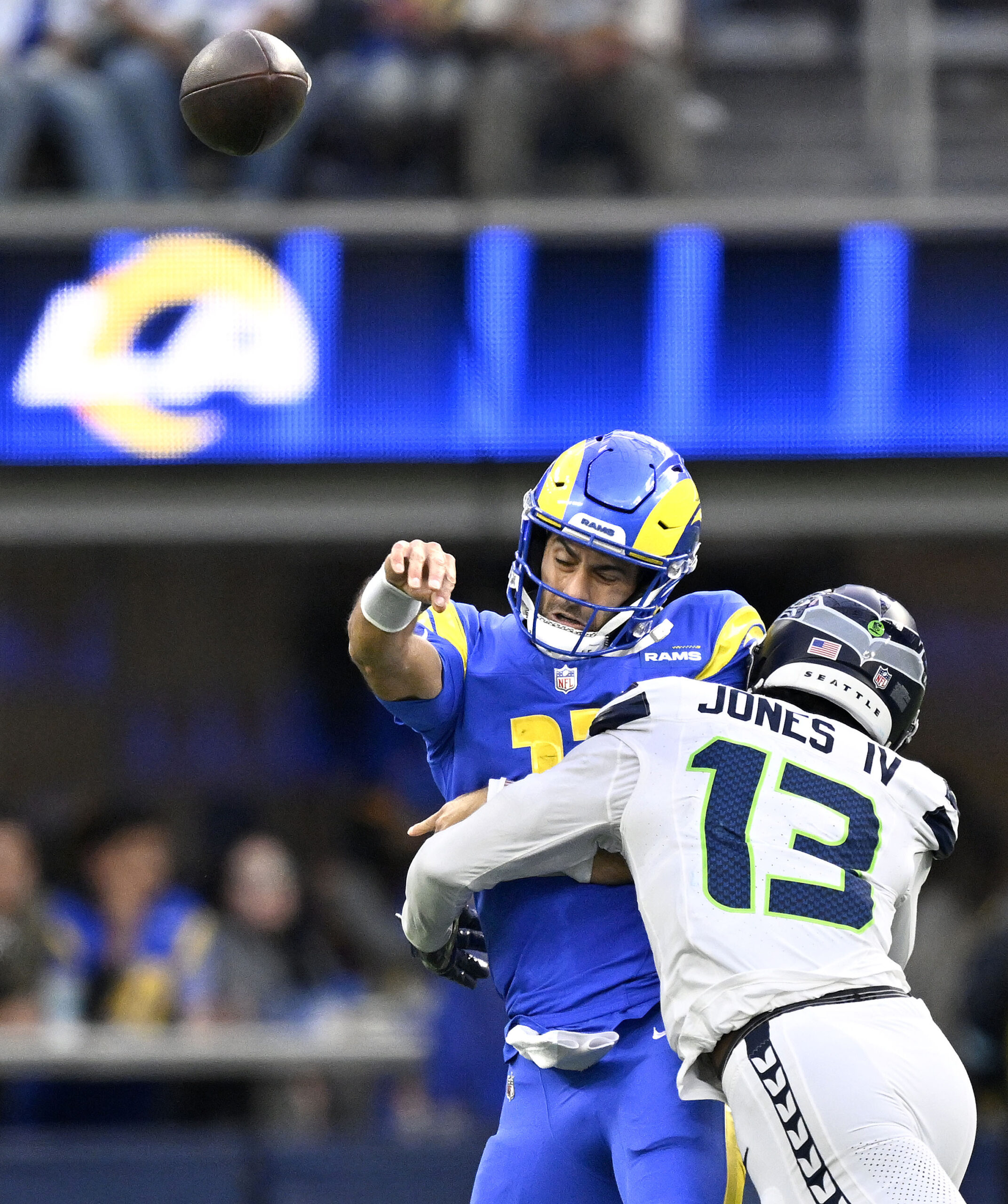 Rams quarterback Jimmy Garoppolo is hit by Seattle’s Marquise Blair...