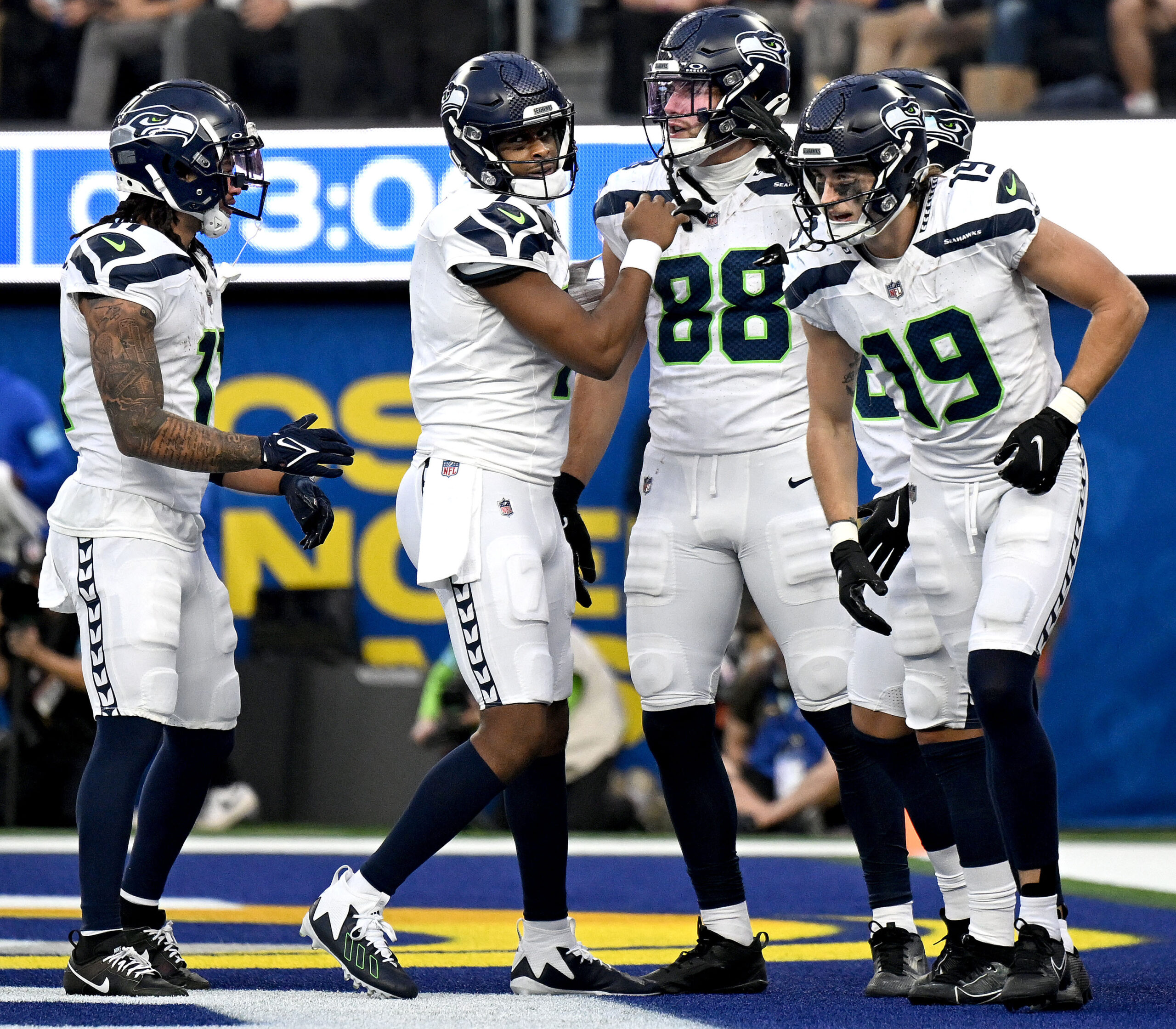 Seattle tightend A.J. Barner (88) celebrates with quarterback Geno Smith,...