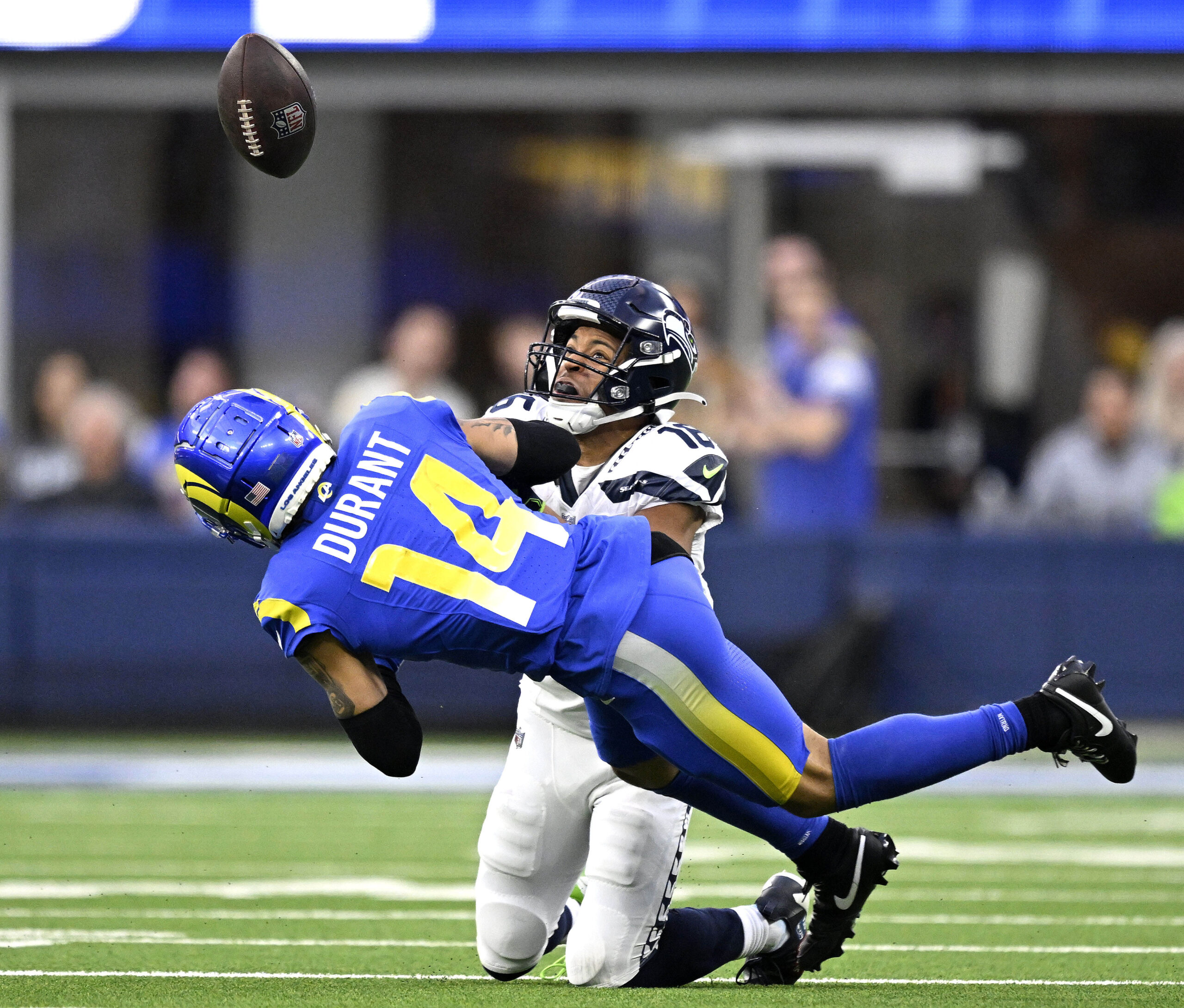 Rams defender Cobie Durant breaks up a pass intended for...