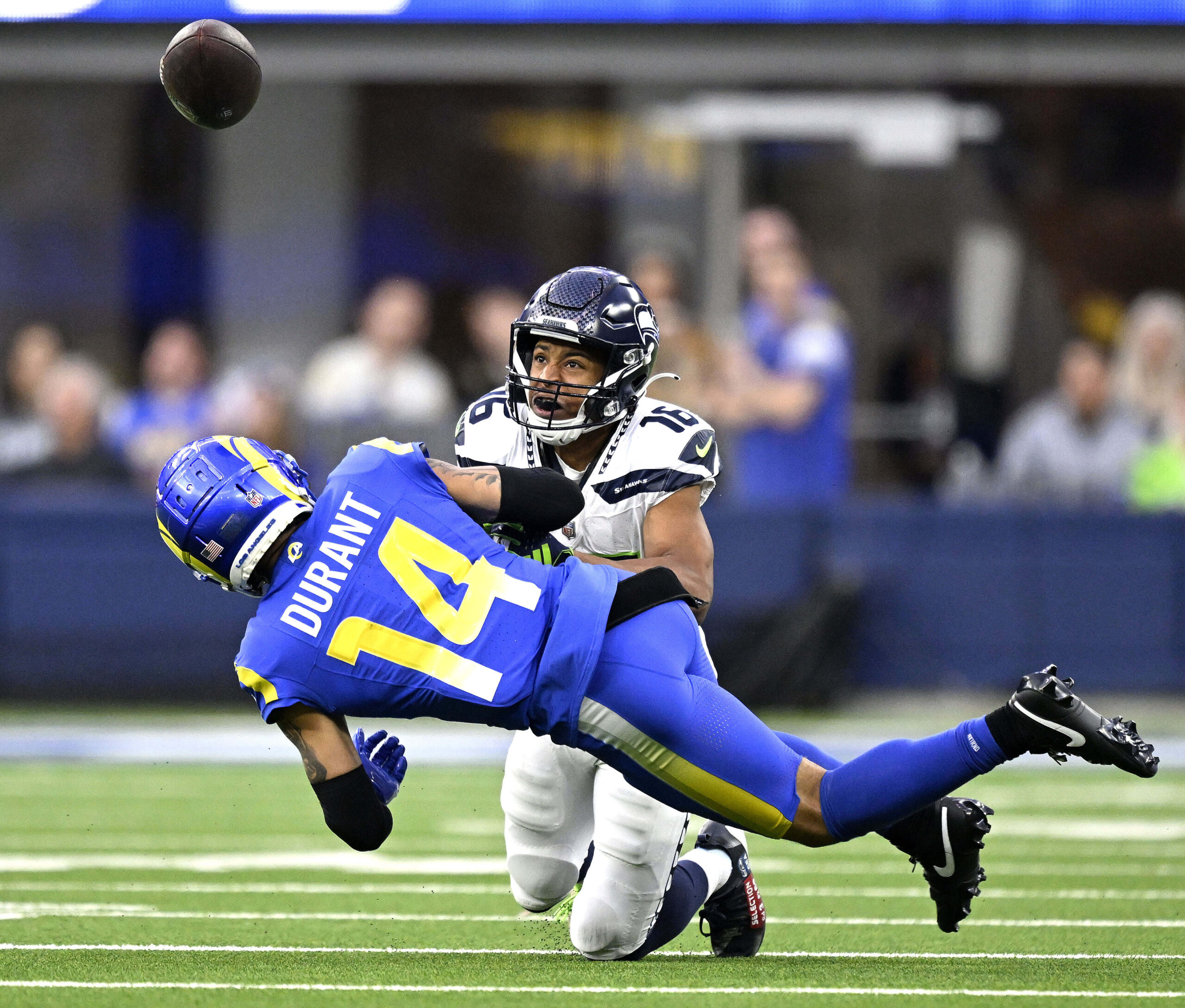 Rams defender Cobie Durant breaks up a pass intended for...