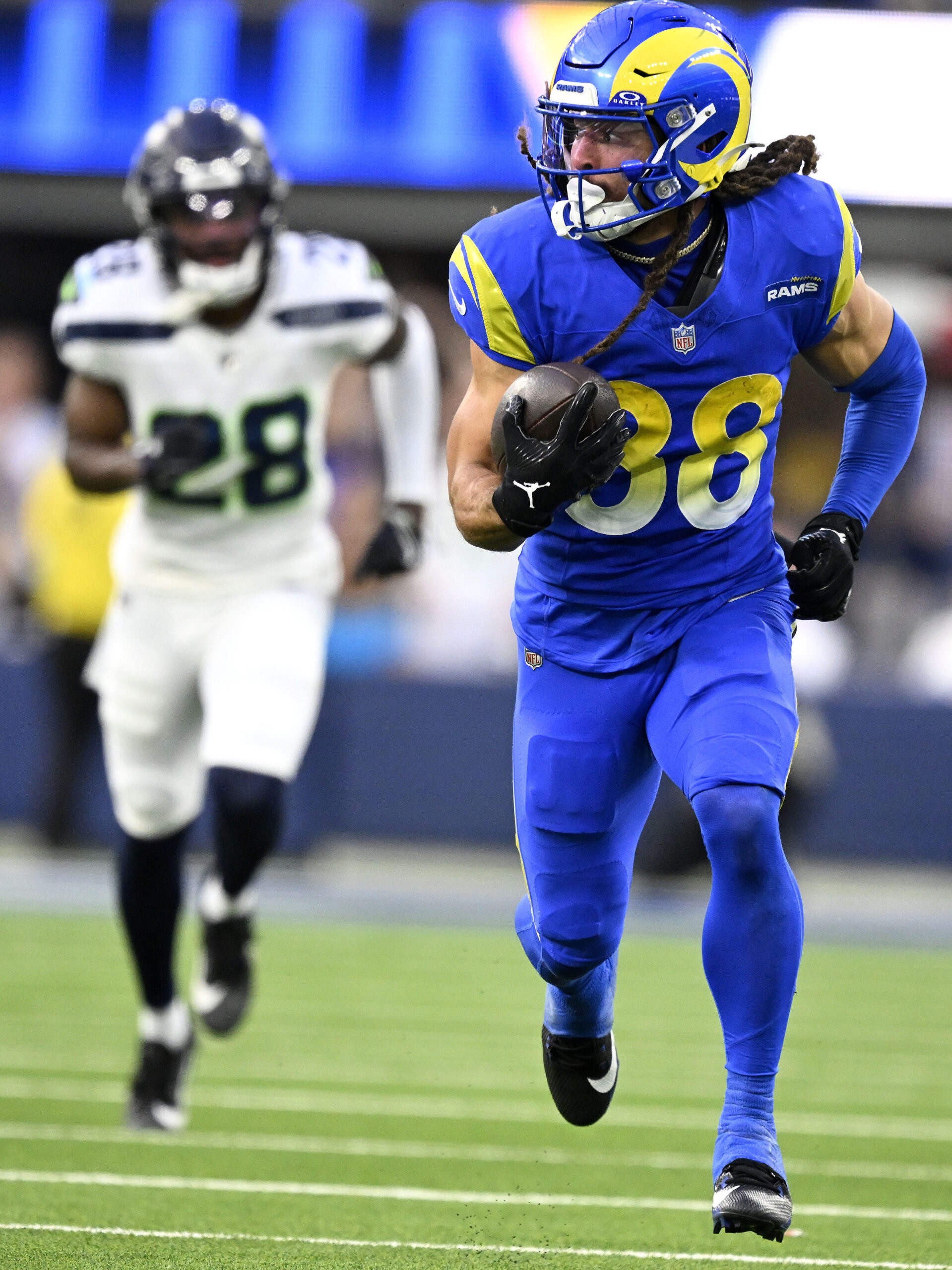 Rams wide receiver Jordan Whittington heads up field for a...