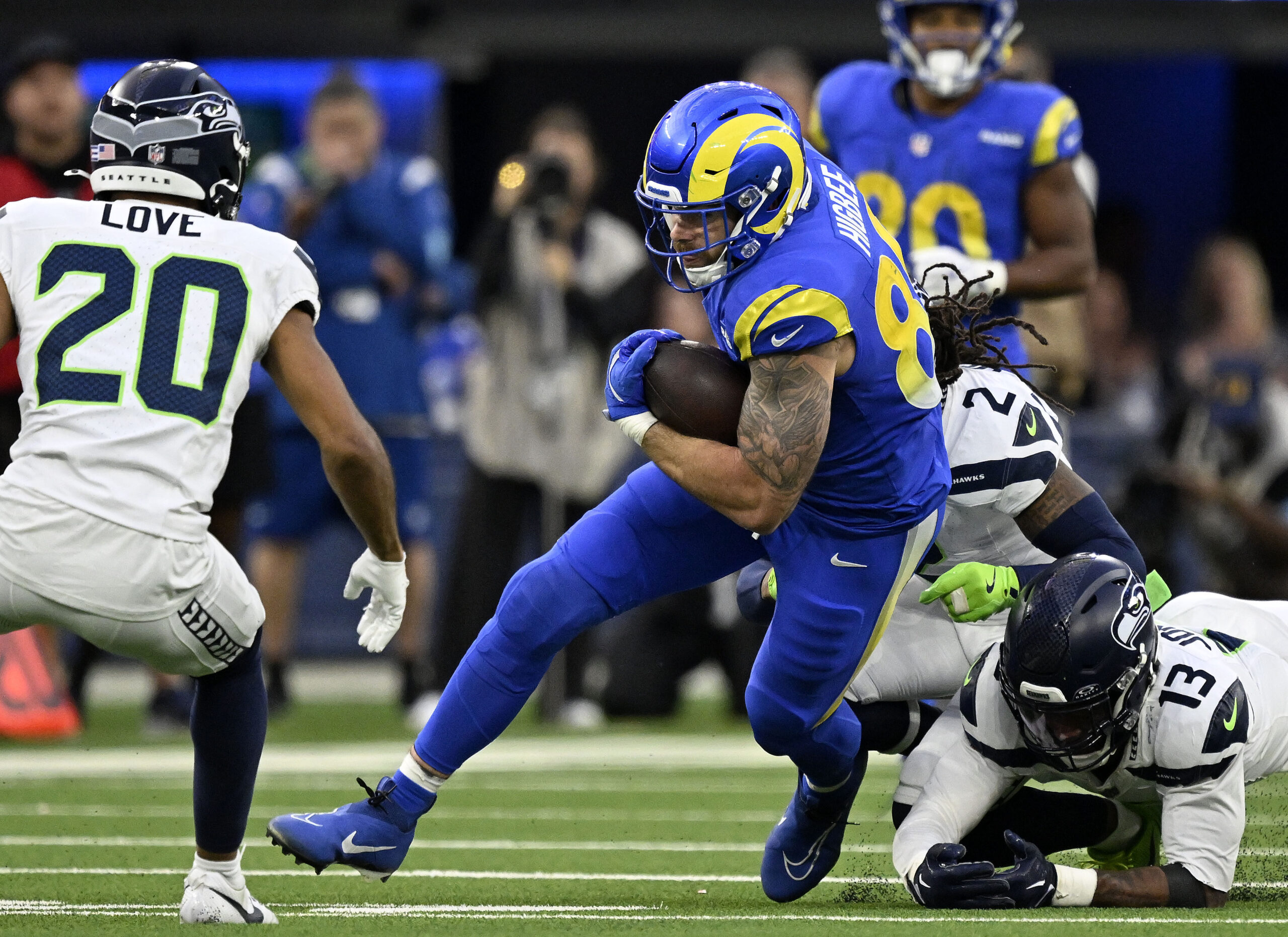 Rams tightend Tyler Higbee heads up field following a reception...