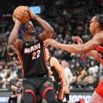 Toronto Raptors forward Scottie Barnes defends against Miami Heat forward Jimmy Butler