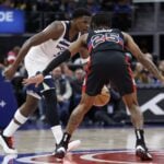 Jan 4, 2025; Detroit, Michigan, USA; Minnesota Timberwolves guard Anthony Edwards (5) dribbles defended by Detroit Pistons guard Marcus Sasser (25) in the second half at Little Caesars Arena.