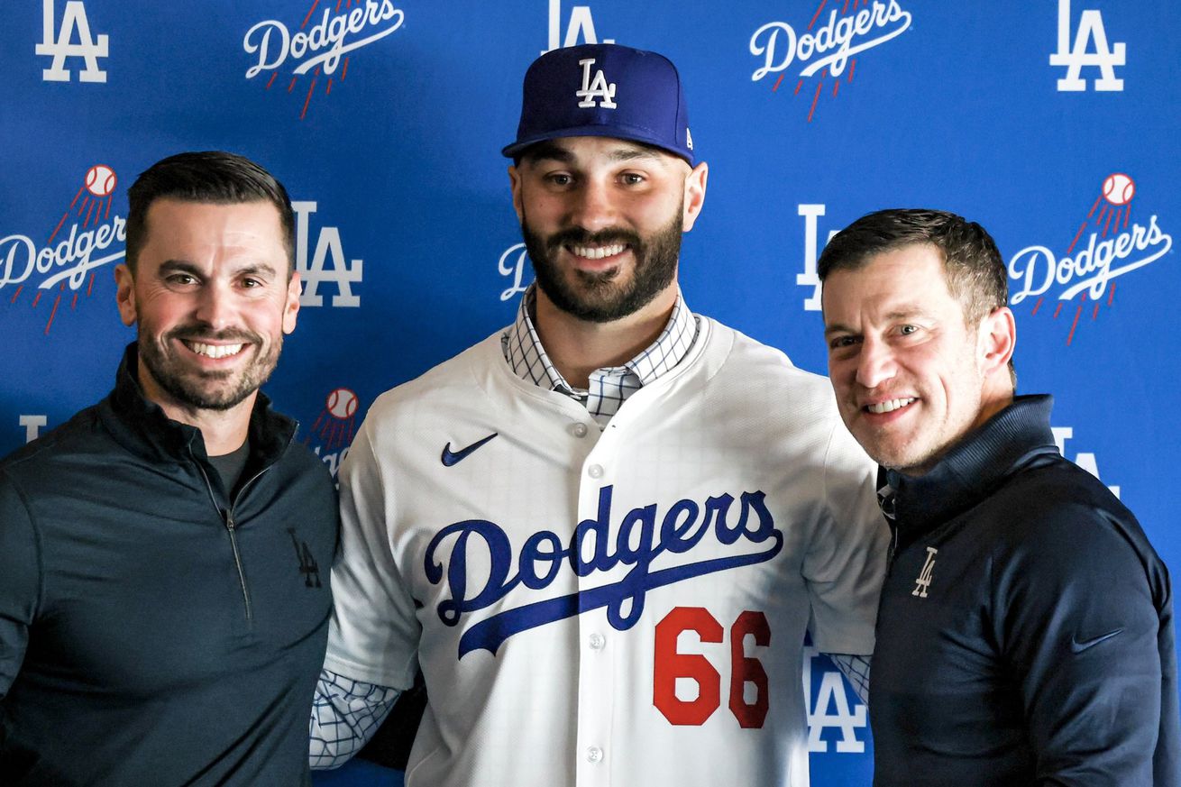 Dodgers relief pitcher Tanner Scott signed a four-year contract, and was introduced at Dodger Stadium on January 23, 2025, in between general manager Brandon Gomes and Andrew Friedman.