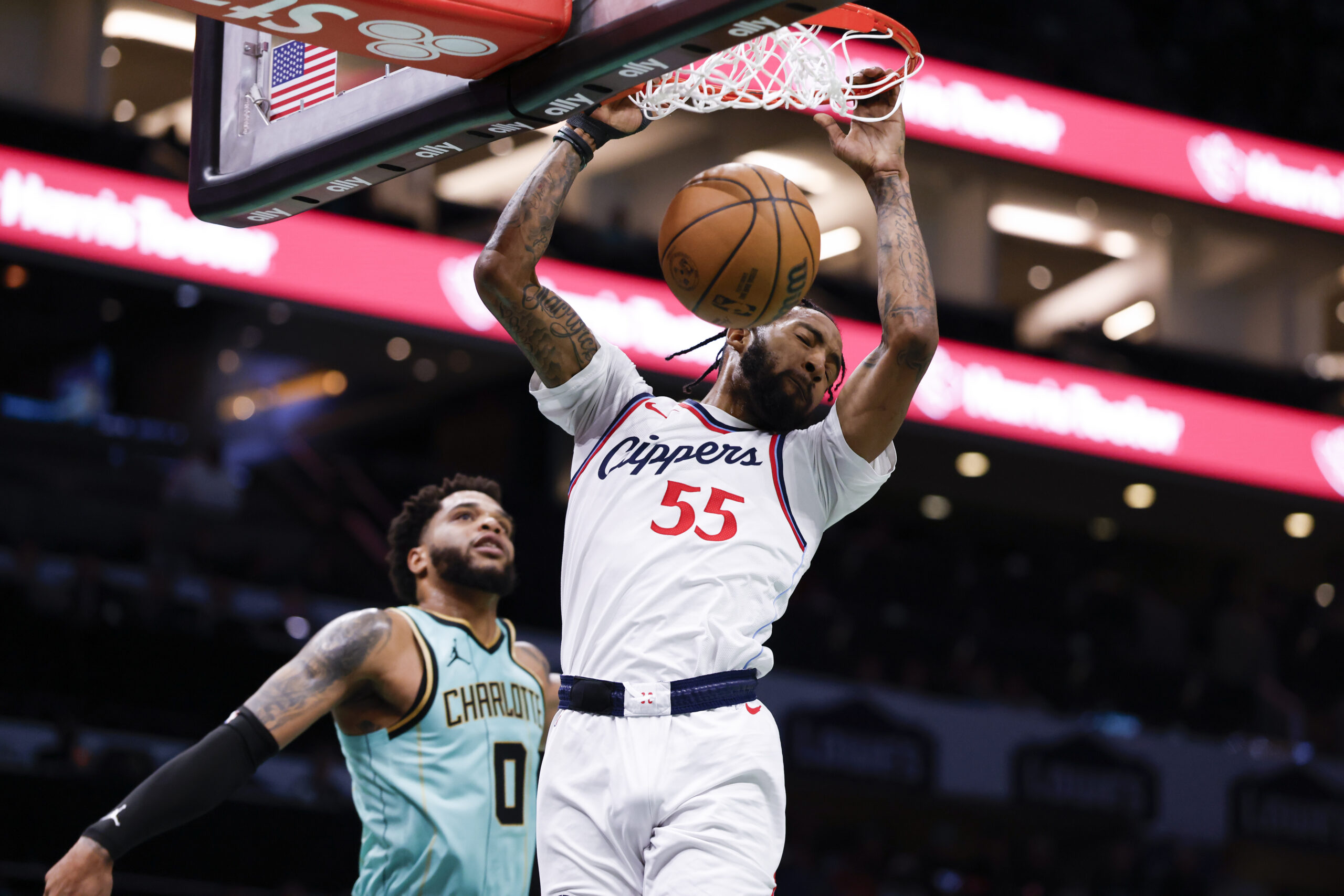 Clippers forward Derrick Jones Jr. dunks in front of Charlotte...