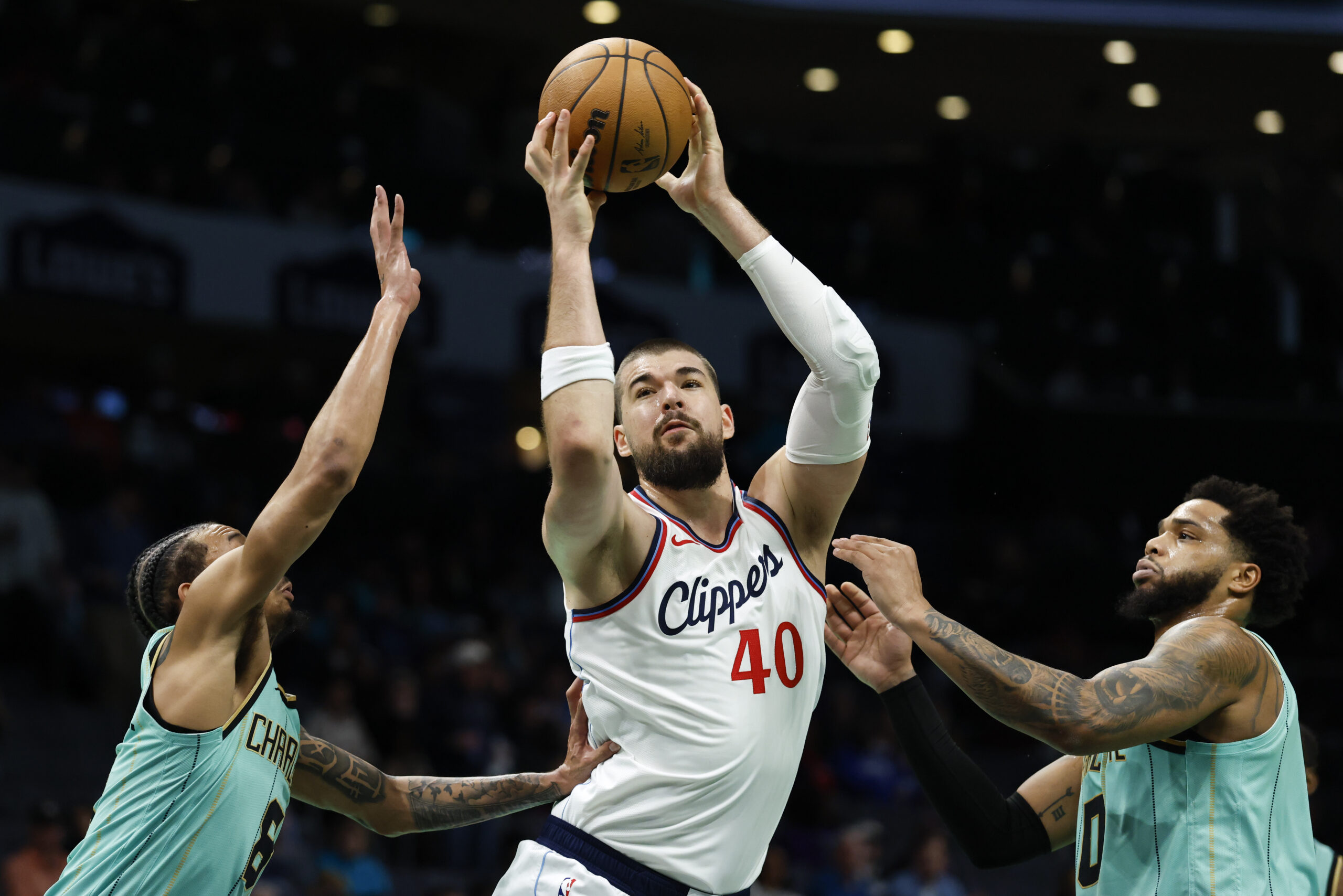 Clippers center Ivica Zubac (40) pulls in a rebound between...