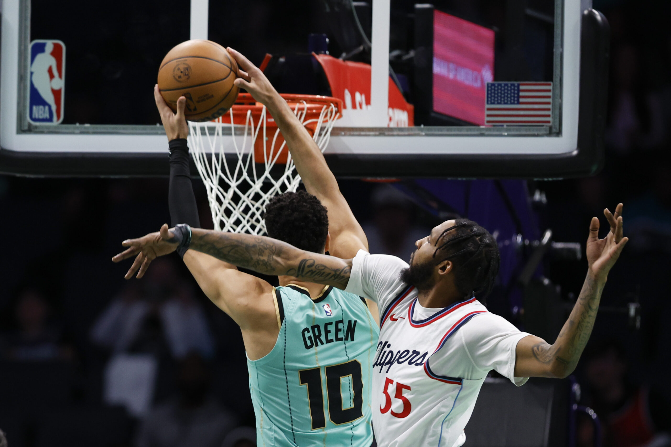 Charlotte Hornets guard Josh Green (10) drives for a dunk...