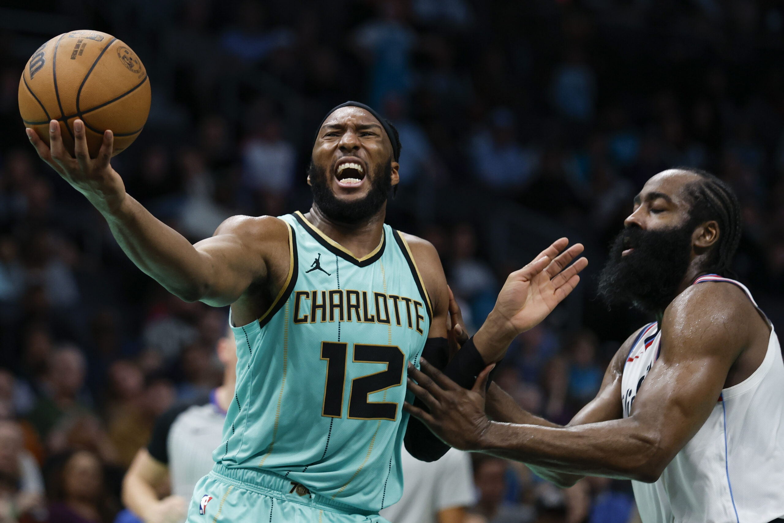 Charlotte Hornets forward Josh Okogie (12) drives to the basket...