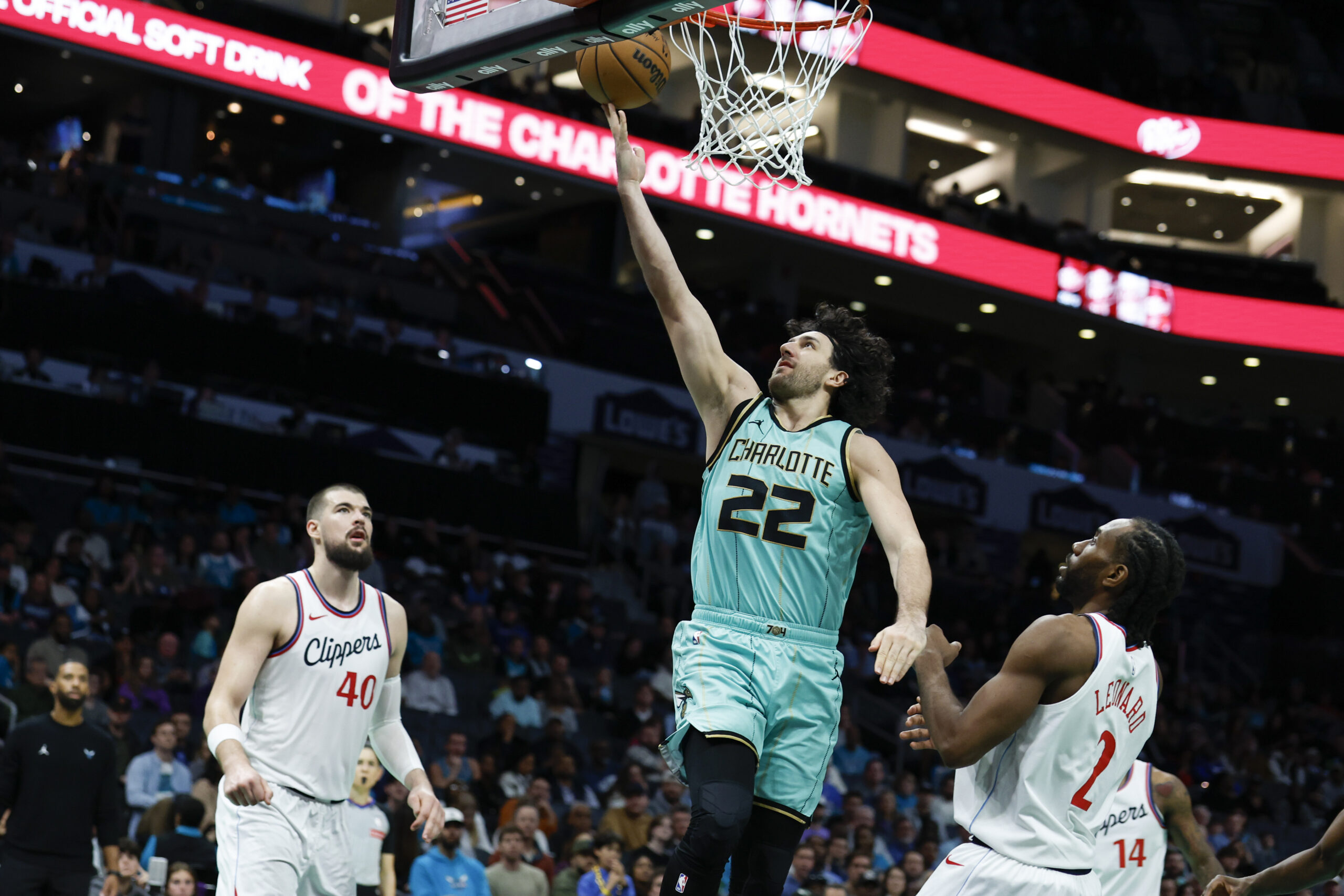 Charlotte Hornets guard Vasa Micic (22) drives to the basket...