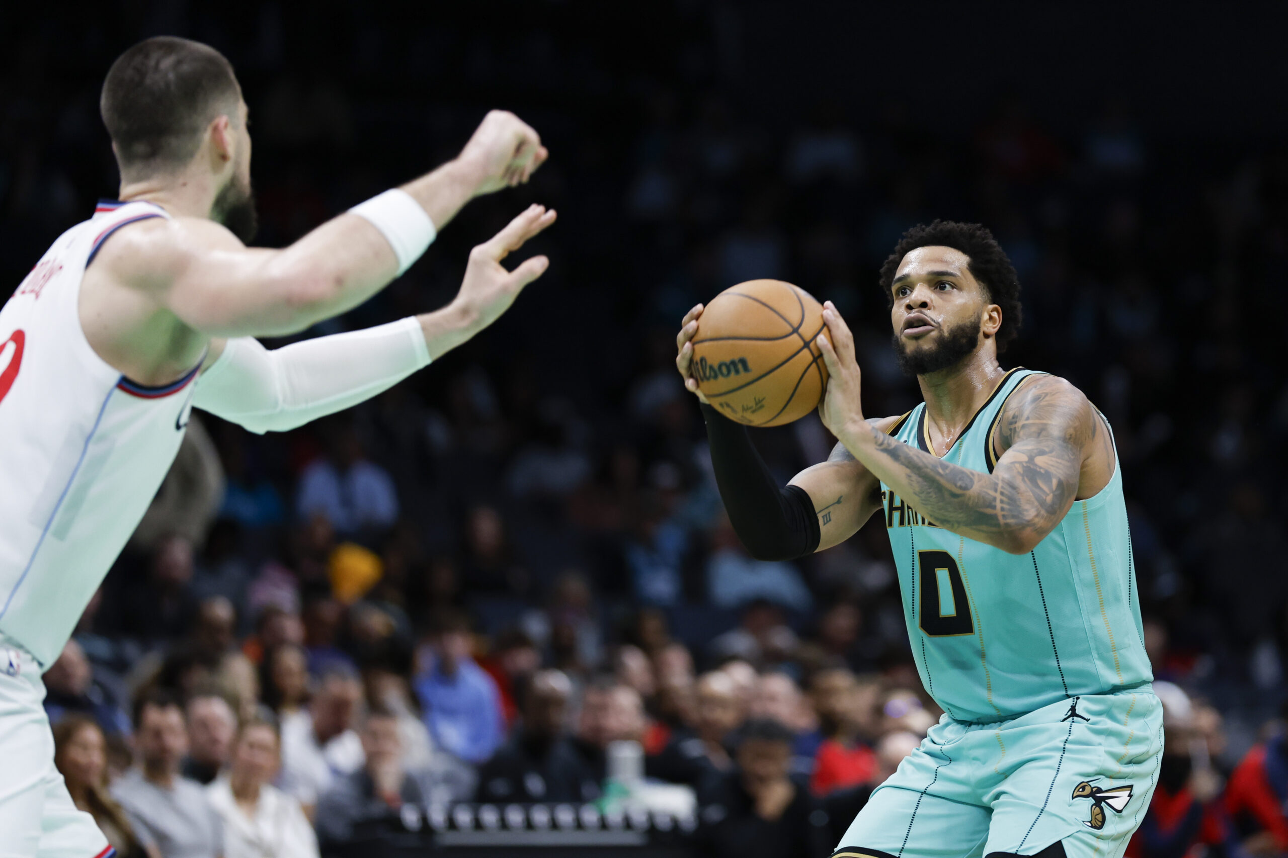 Charlotte Hornets forward Miles Bridges (0) looks to shoot over...