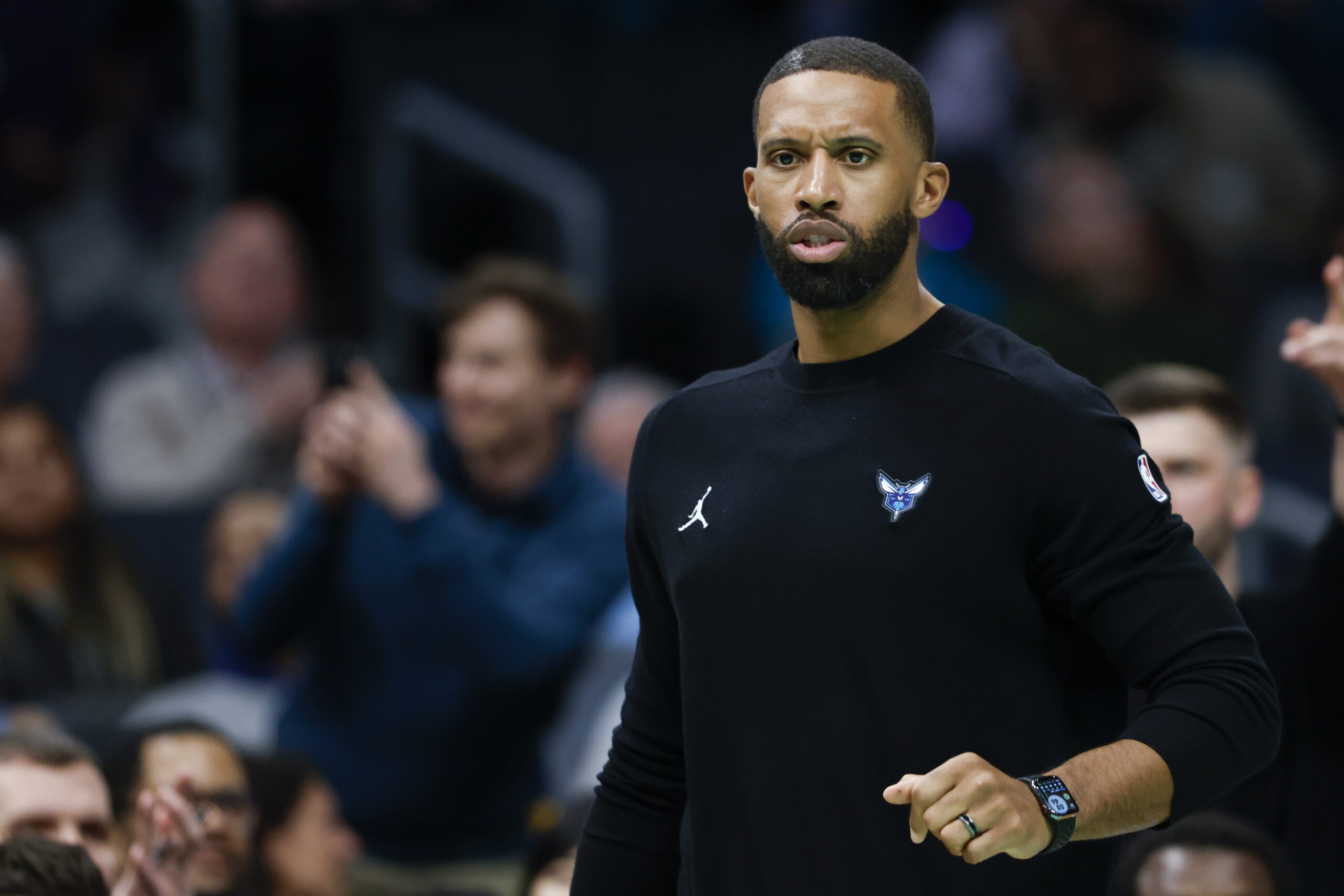 Charlotte Hornets head coach Charles Lee directs his team against...