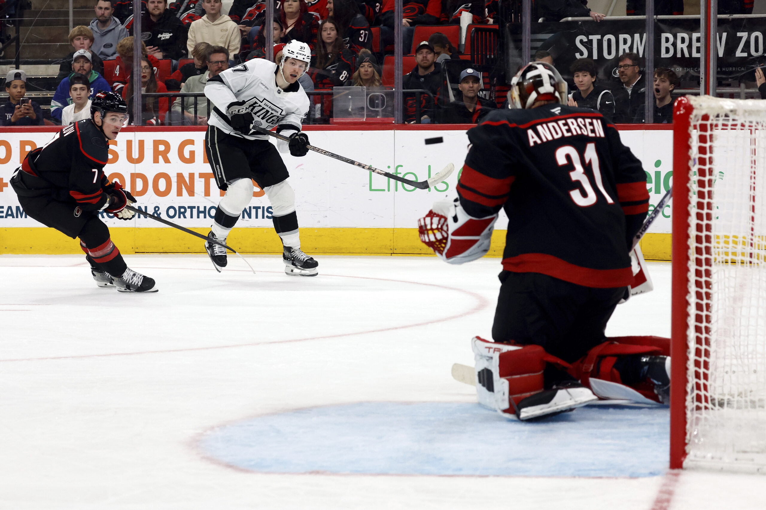 Kings’ Warren Foegele (37) shoots the puck at Carolina Hurricanes...