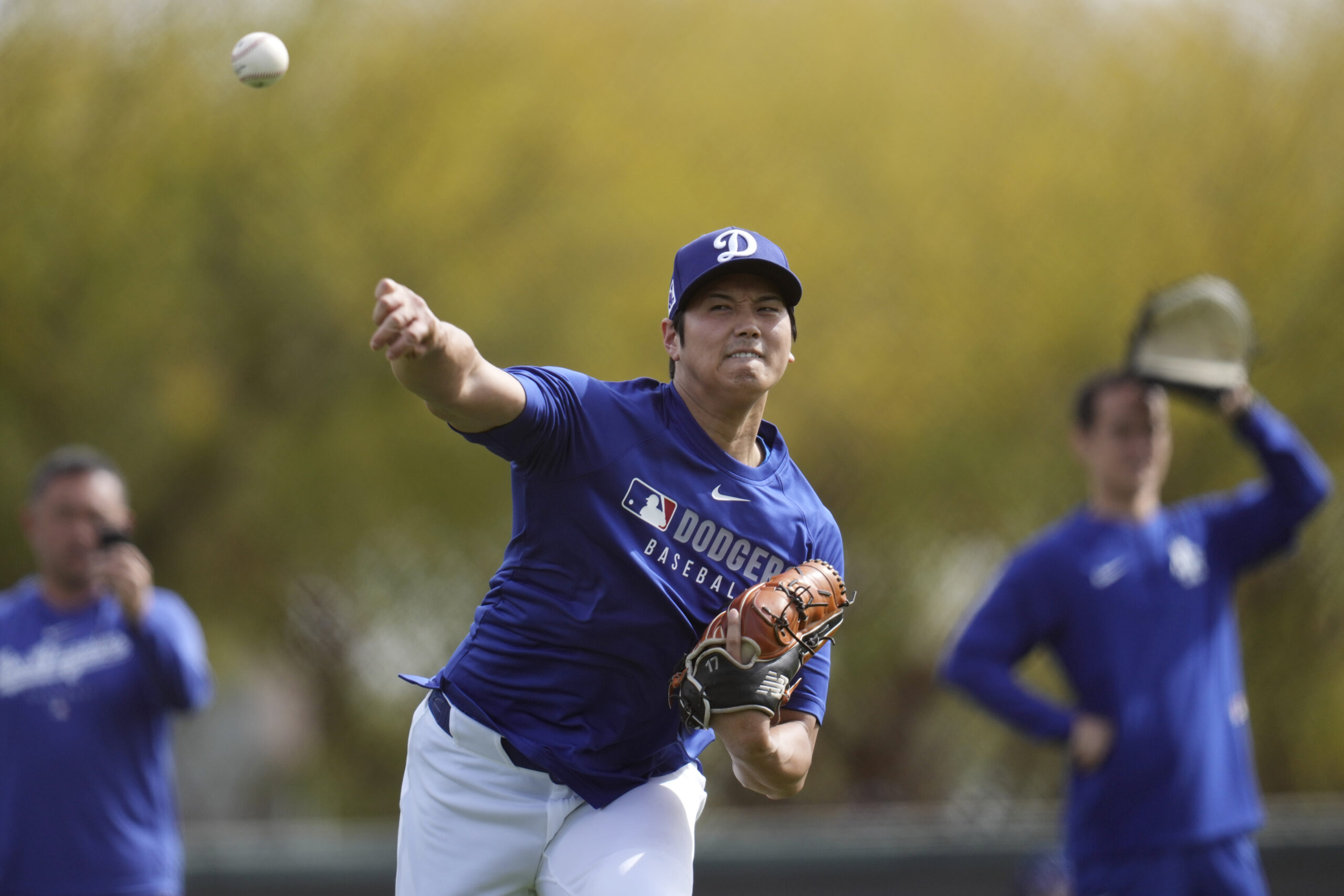 Dodgers star Shohei Ohtani warms up on Tuesday at their...