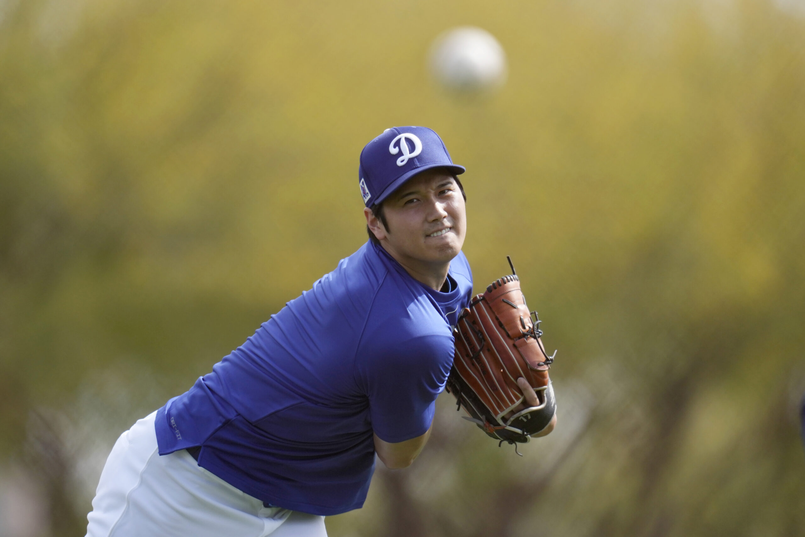 Dodgers star Shohei Ohtani warms up on Tuesday at their...