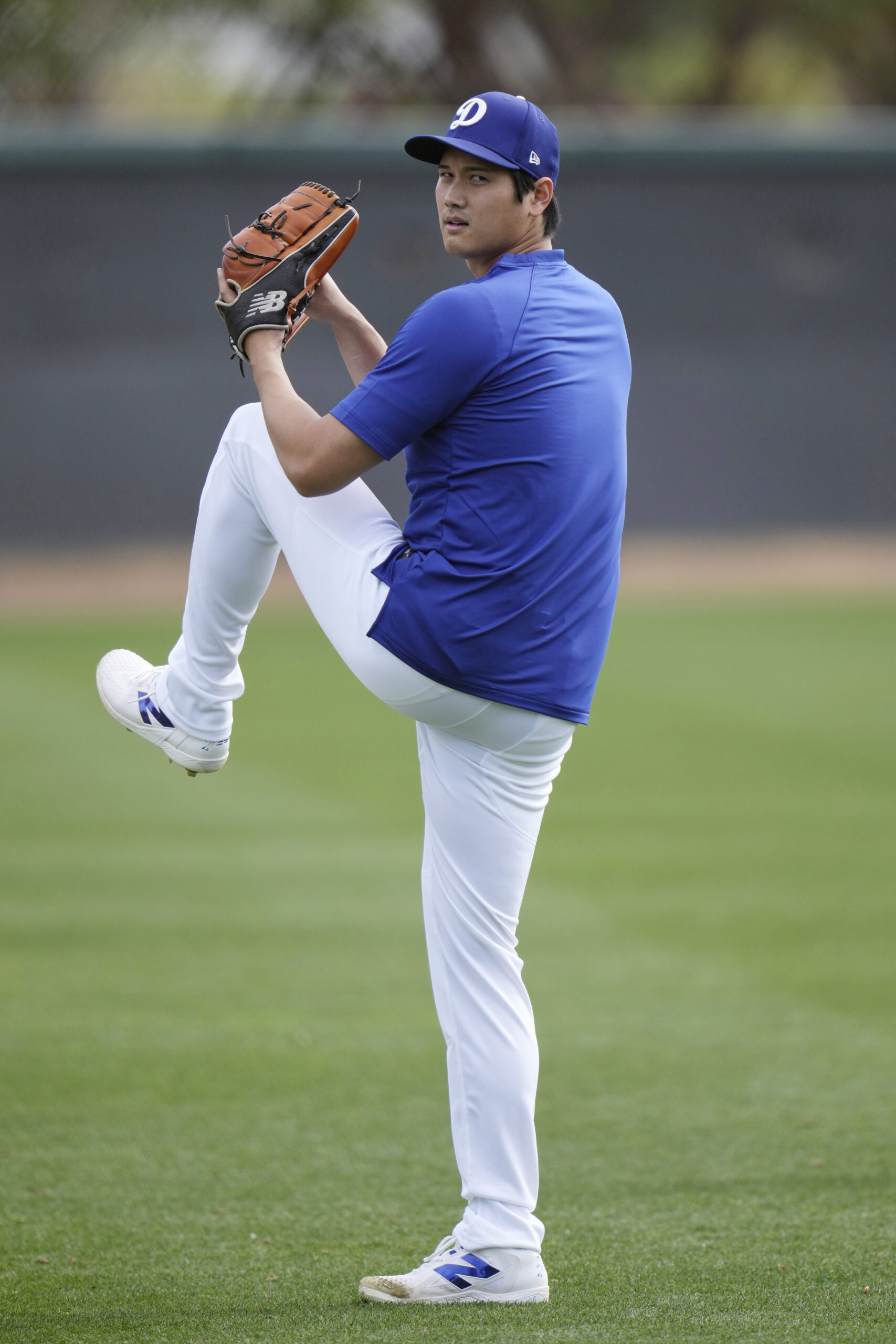 Dodgers star Shohei Ohtani warms up on Tuesday at their...