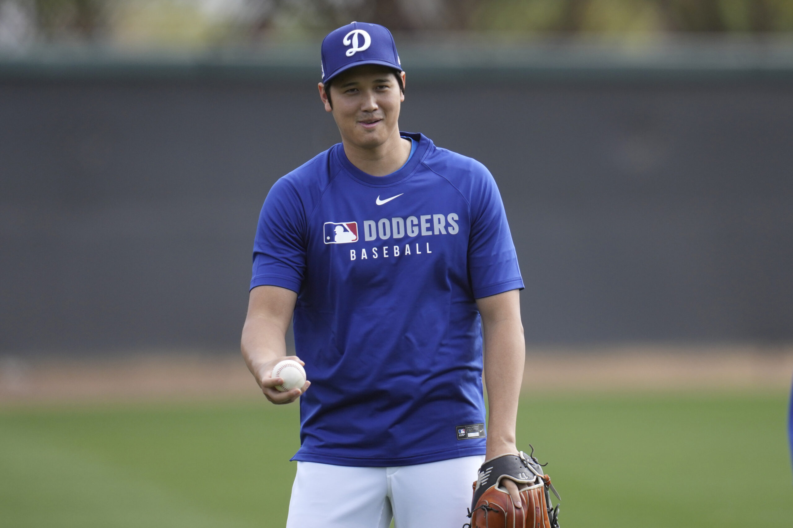 Dodgers star Shohei Ohtani warms up on Tuesday at their...