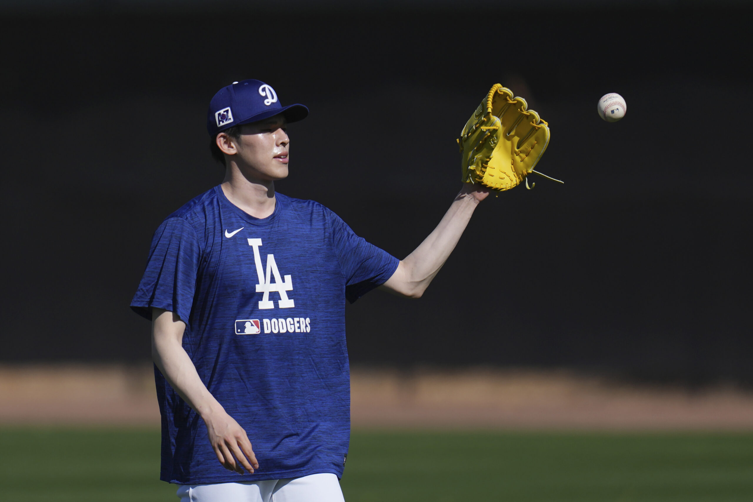 Dodgers pitcher Roki Sasaki warms up on Tuesday at their...