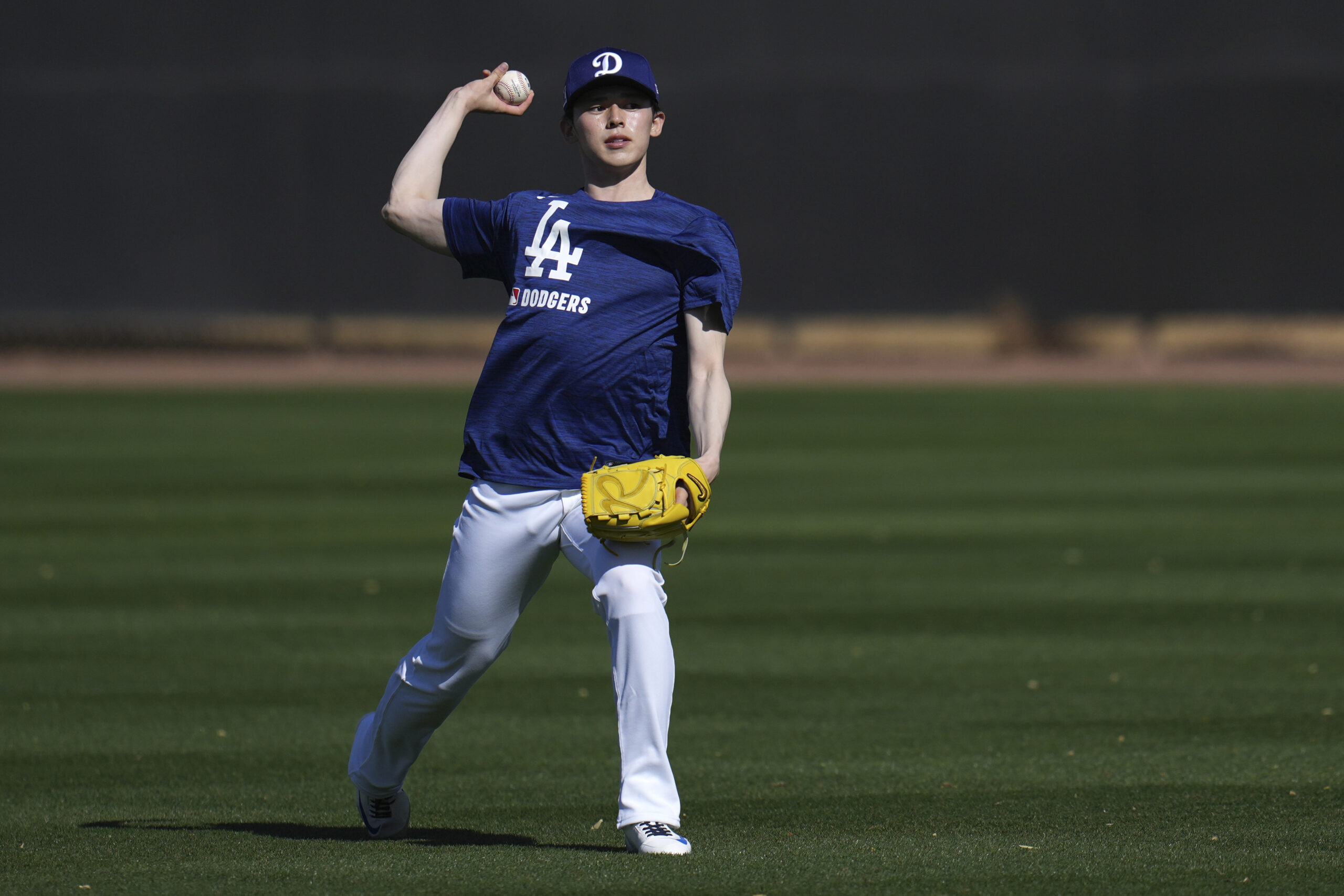 Dodgers pitcher Roki Sasaki warms up on Tuesday at their...