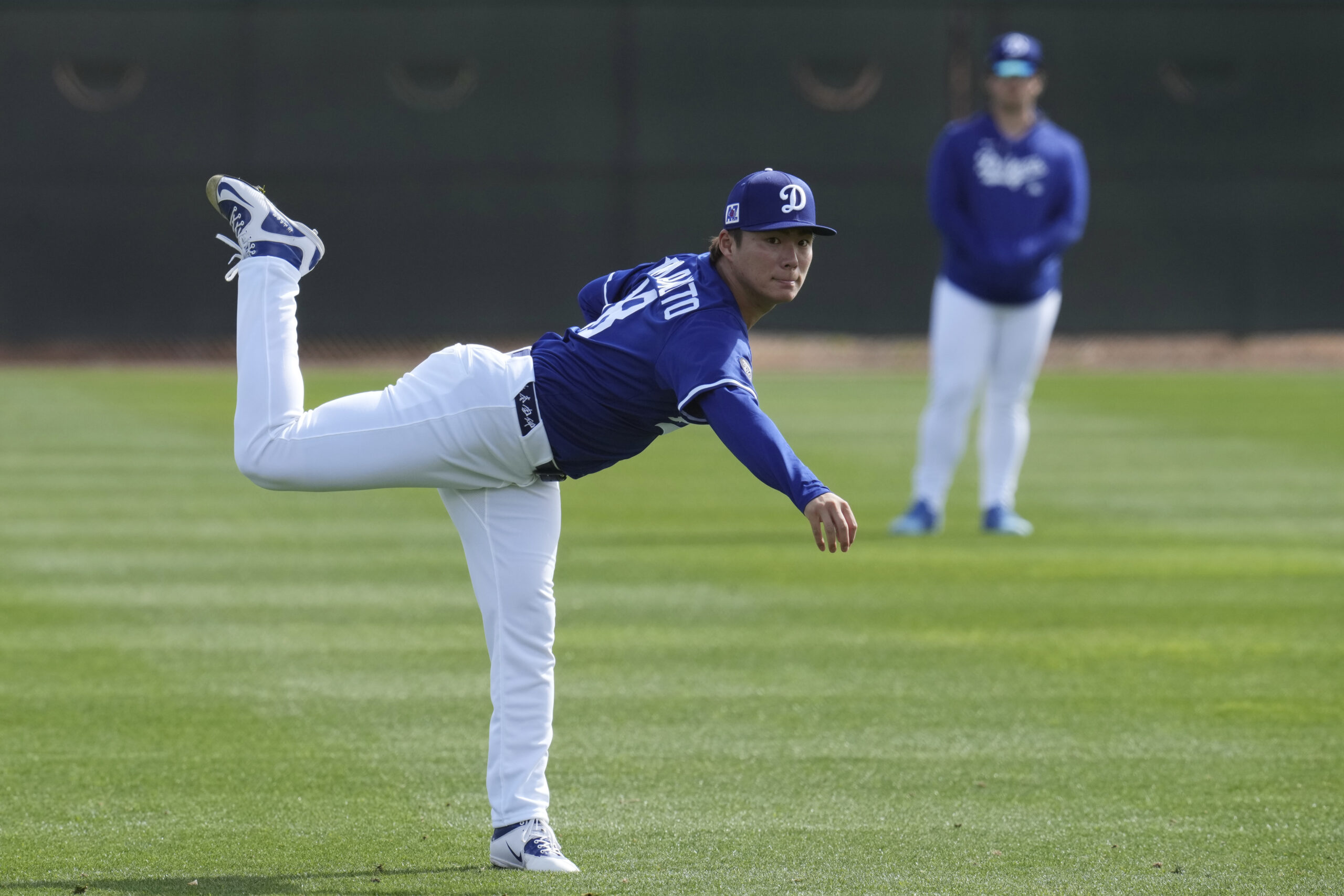 Dodgers pitcher Yoshinobu Yamamoto warms up on Tuesday at their...