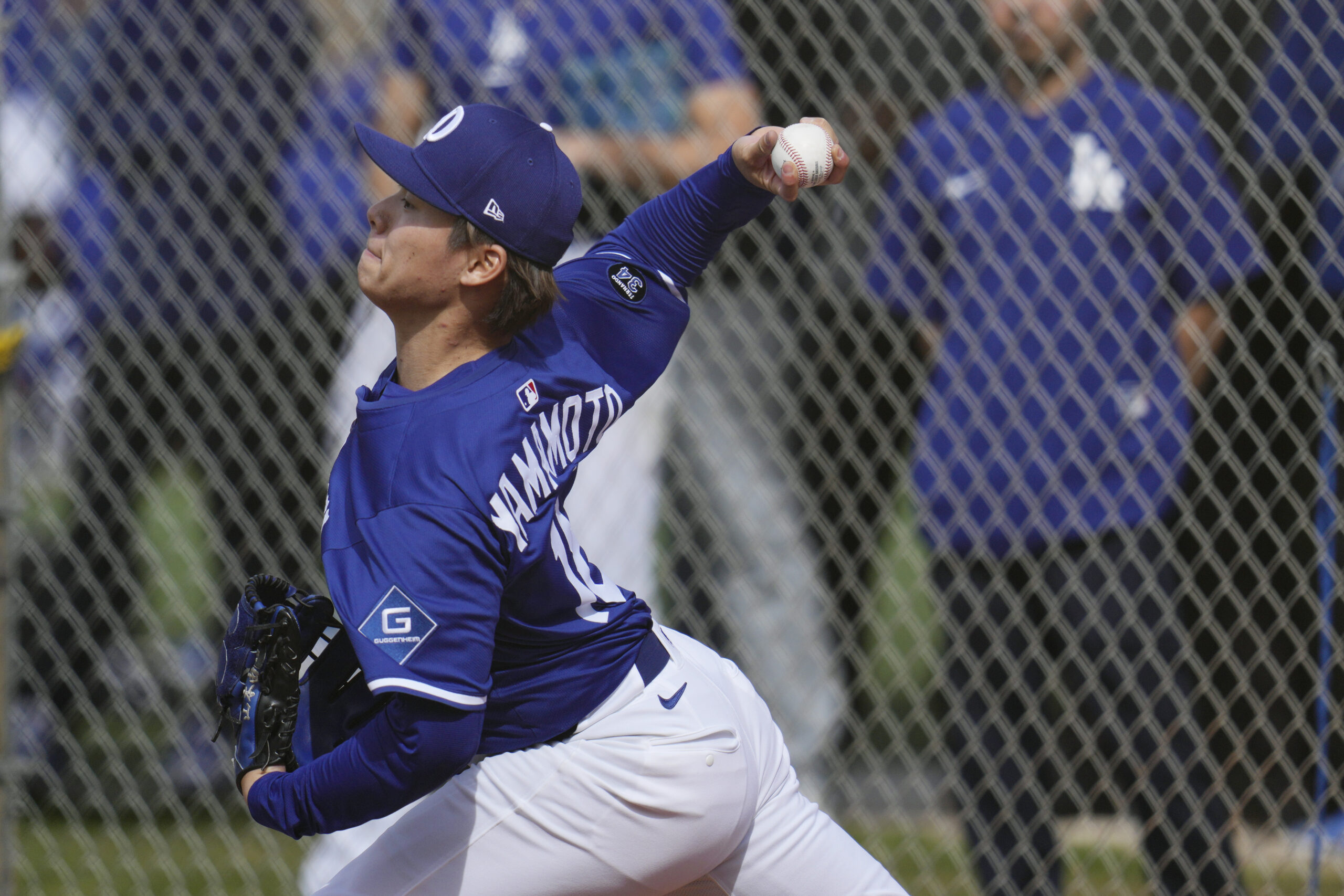 Dodgers pitcher Yoshinobu Yamamoto throws during a pitching session on...