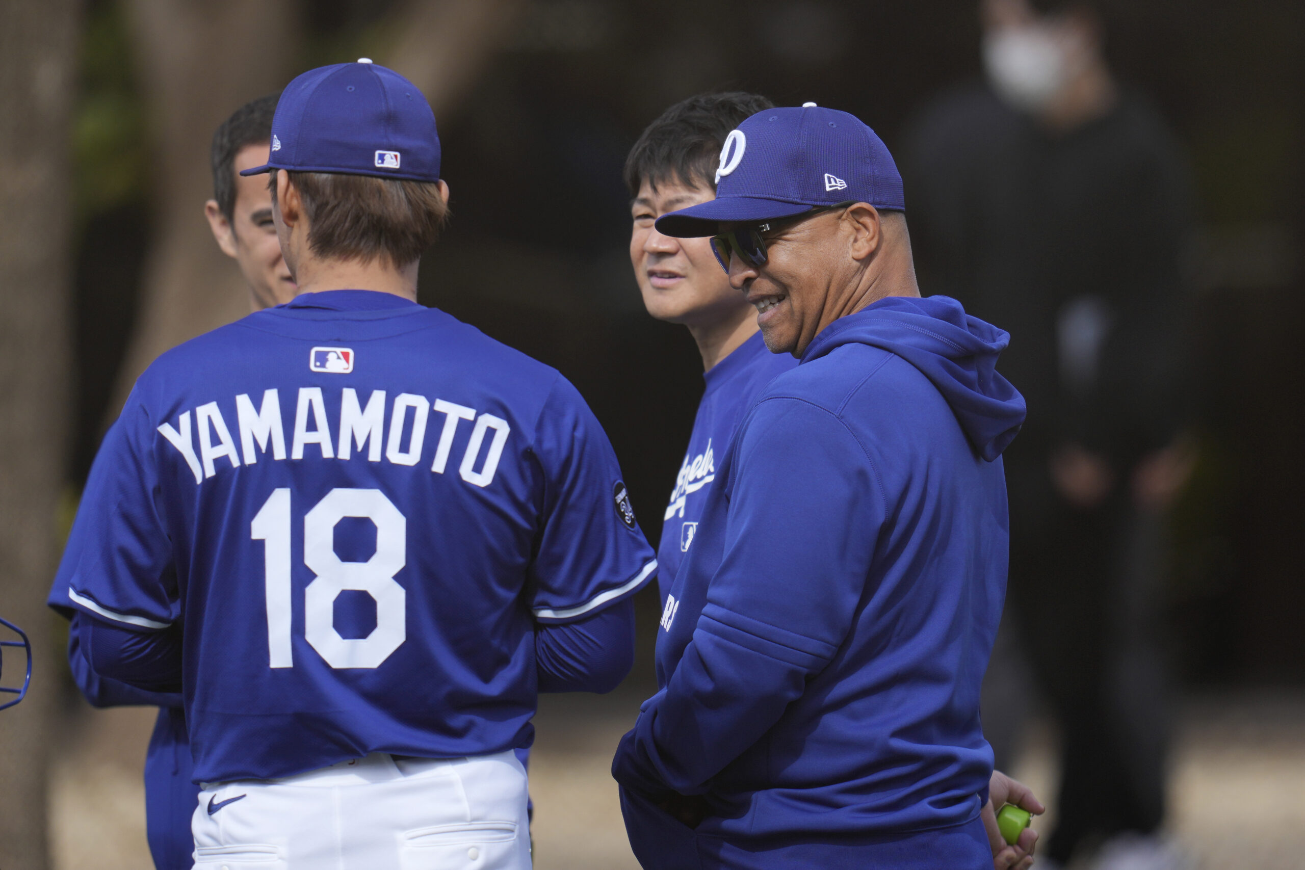 Dodgers pitcher Yoshinobu Yamamoto (18) gets a smile out of...