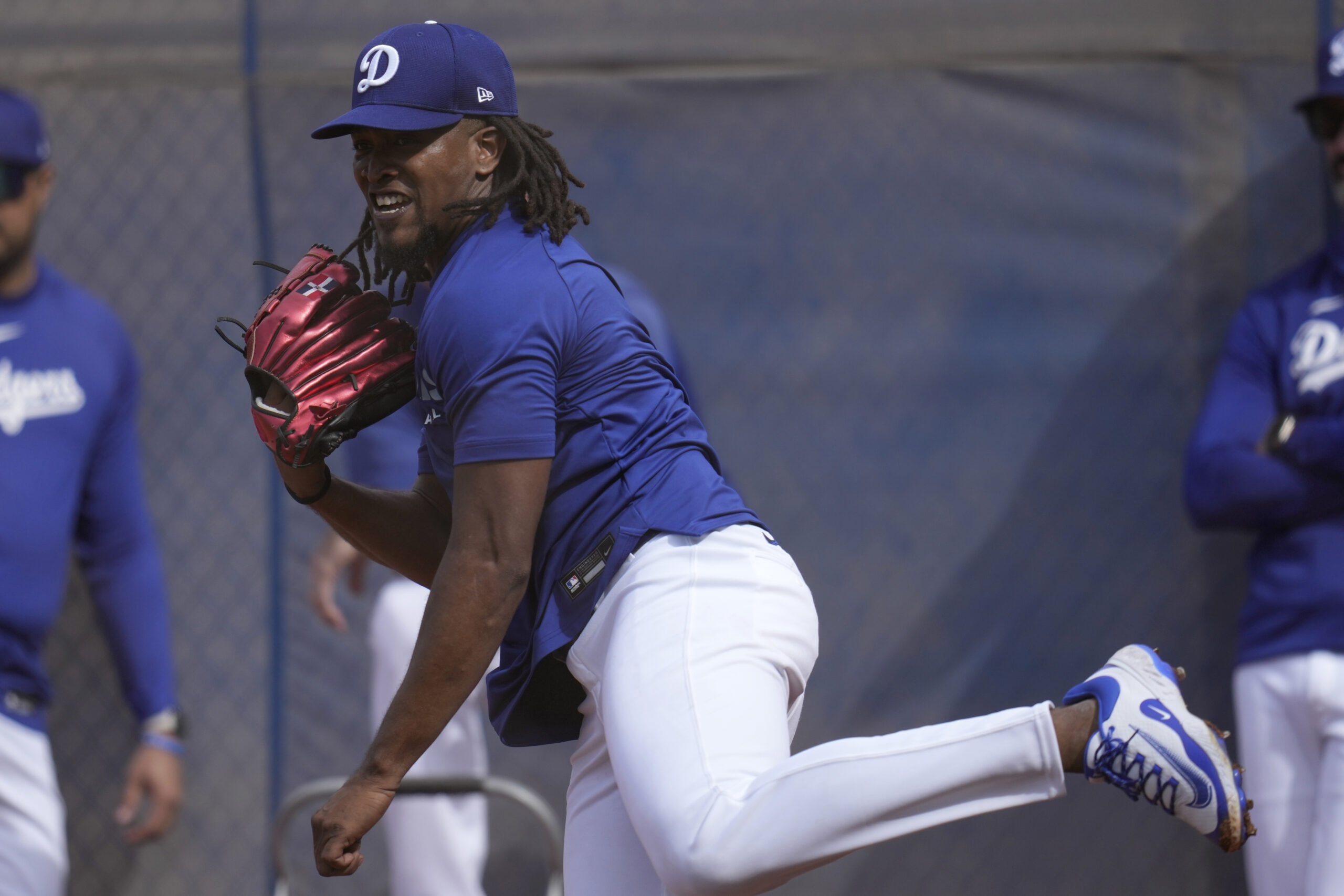 Dodgers pitcher Jose E. Hernandez follows through with a pitch...