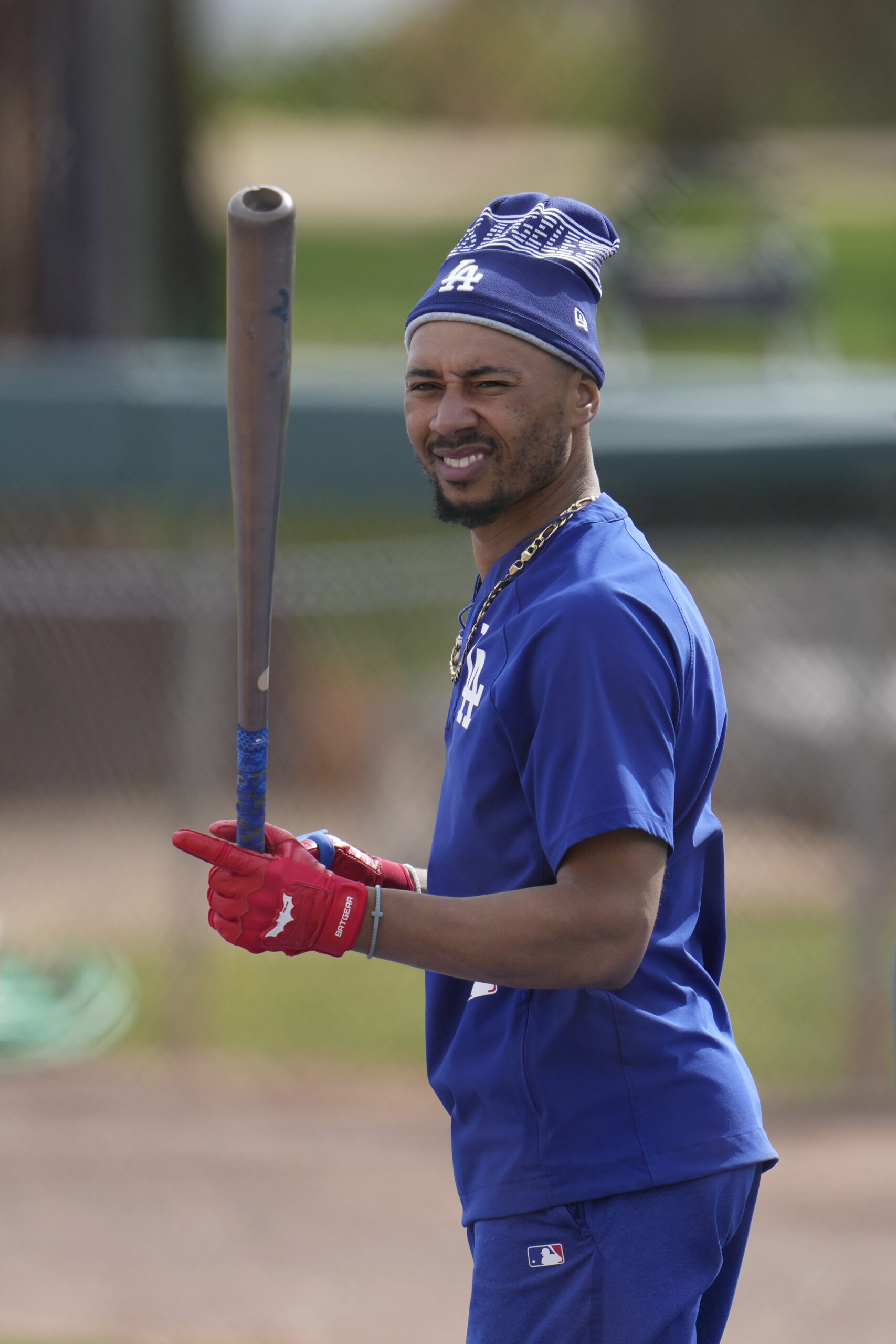 Dodgers star Mookie Betts waits his turn to take batting...